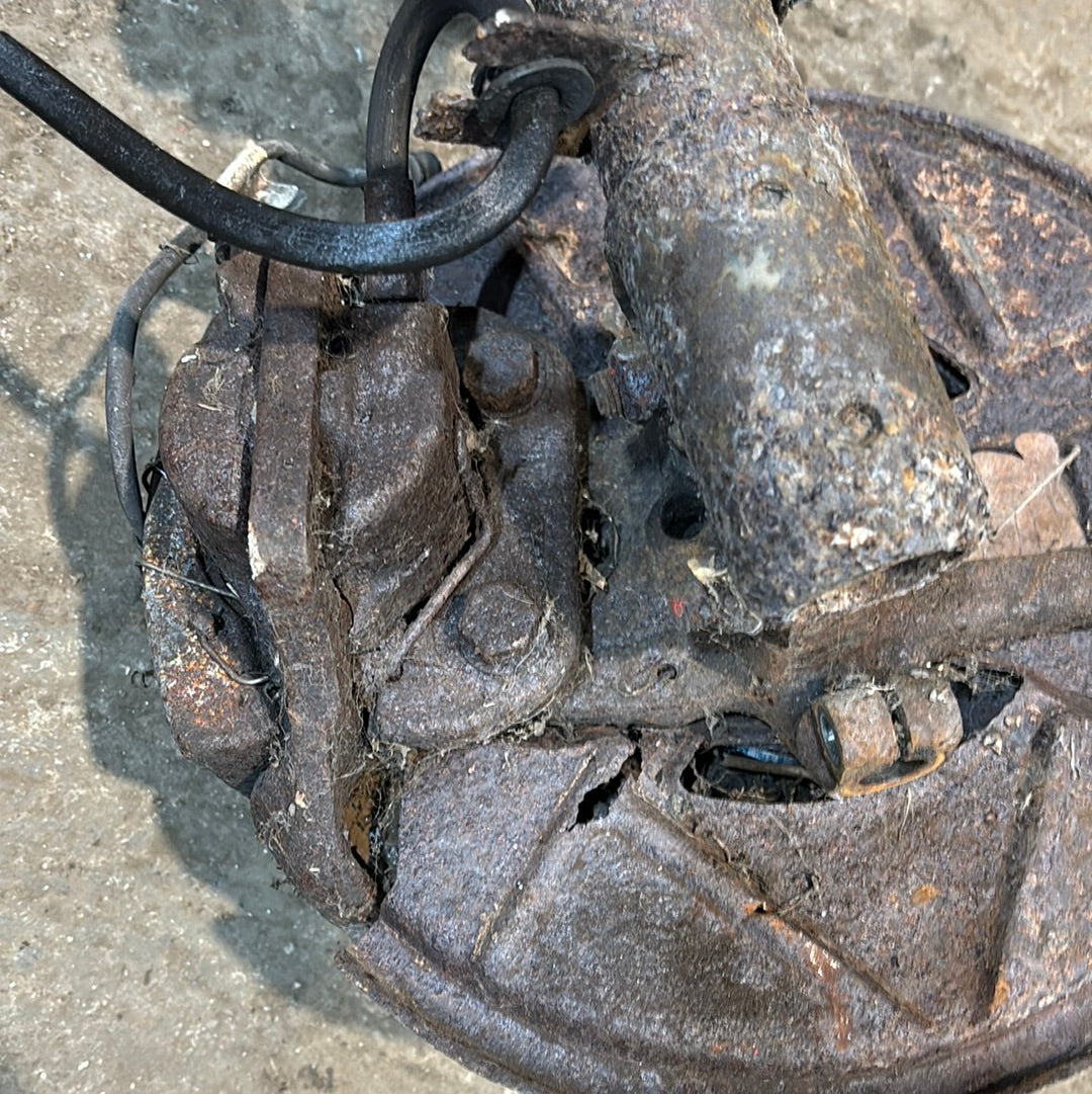 Porsche 944 early used pair of front suspension legs with brake calipers