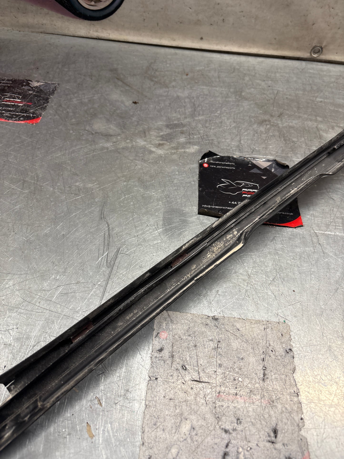 Porsche 944 85.5- left sill trim, scuff plate used 94455112100 cracked