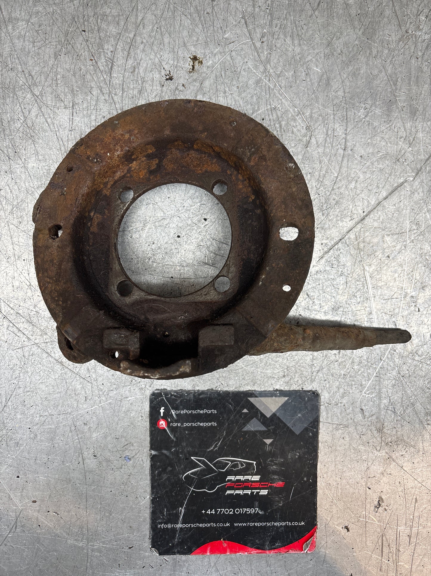 Porsche 924 Turbo rear brake caliper carrier bracket 477609426A 477609112 (right) hand brake cable support, used