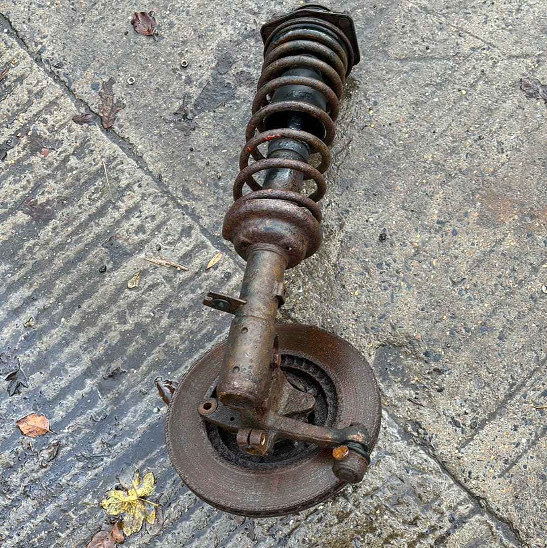 Porsche 944 early used pair of front suspension legs without brake calipers, used