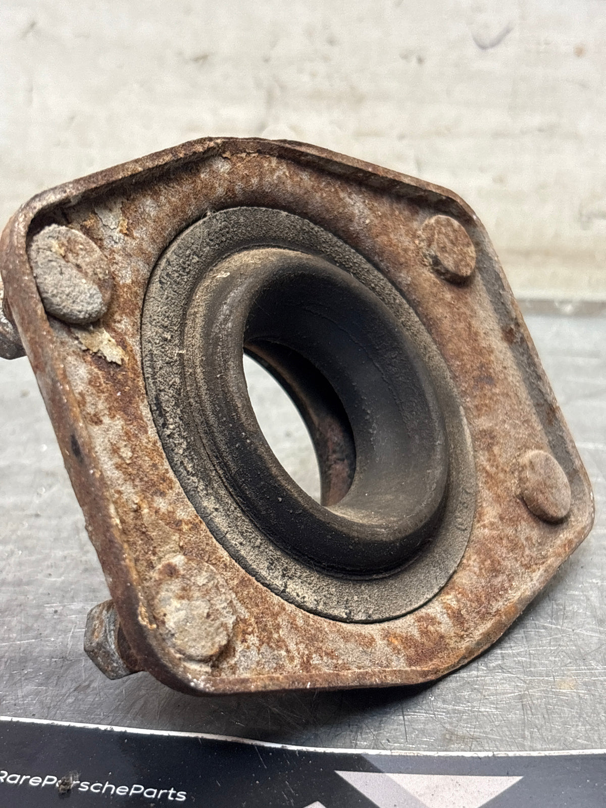 Porsche 924 / 944 front suspension bearing flange, 477412345, used