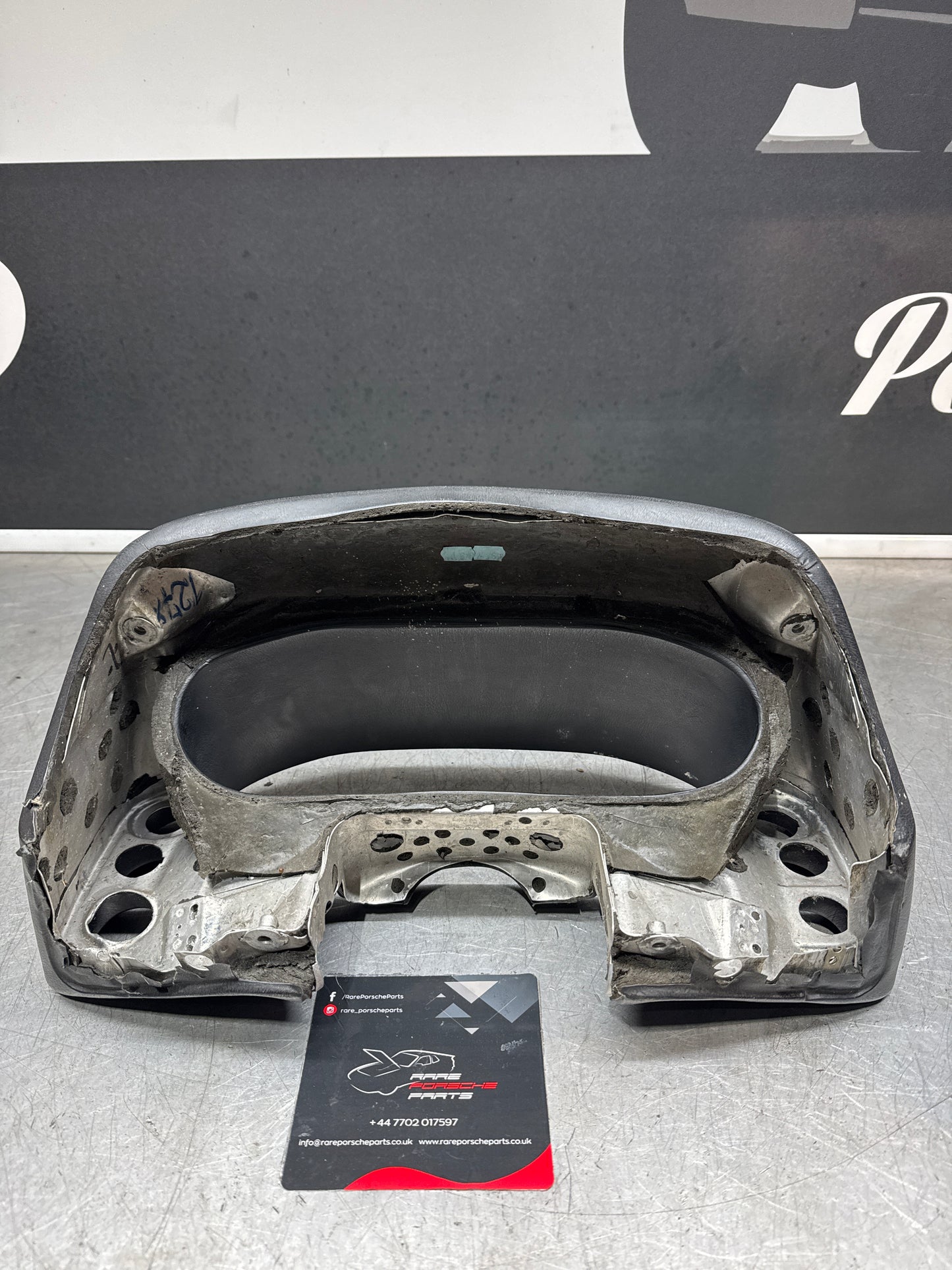 Porsche 928 speedometer cluster frame, 92855203102, black, used