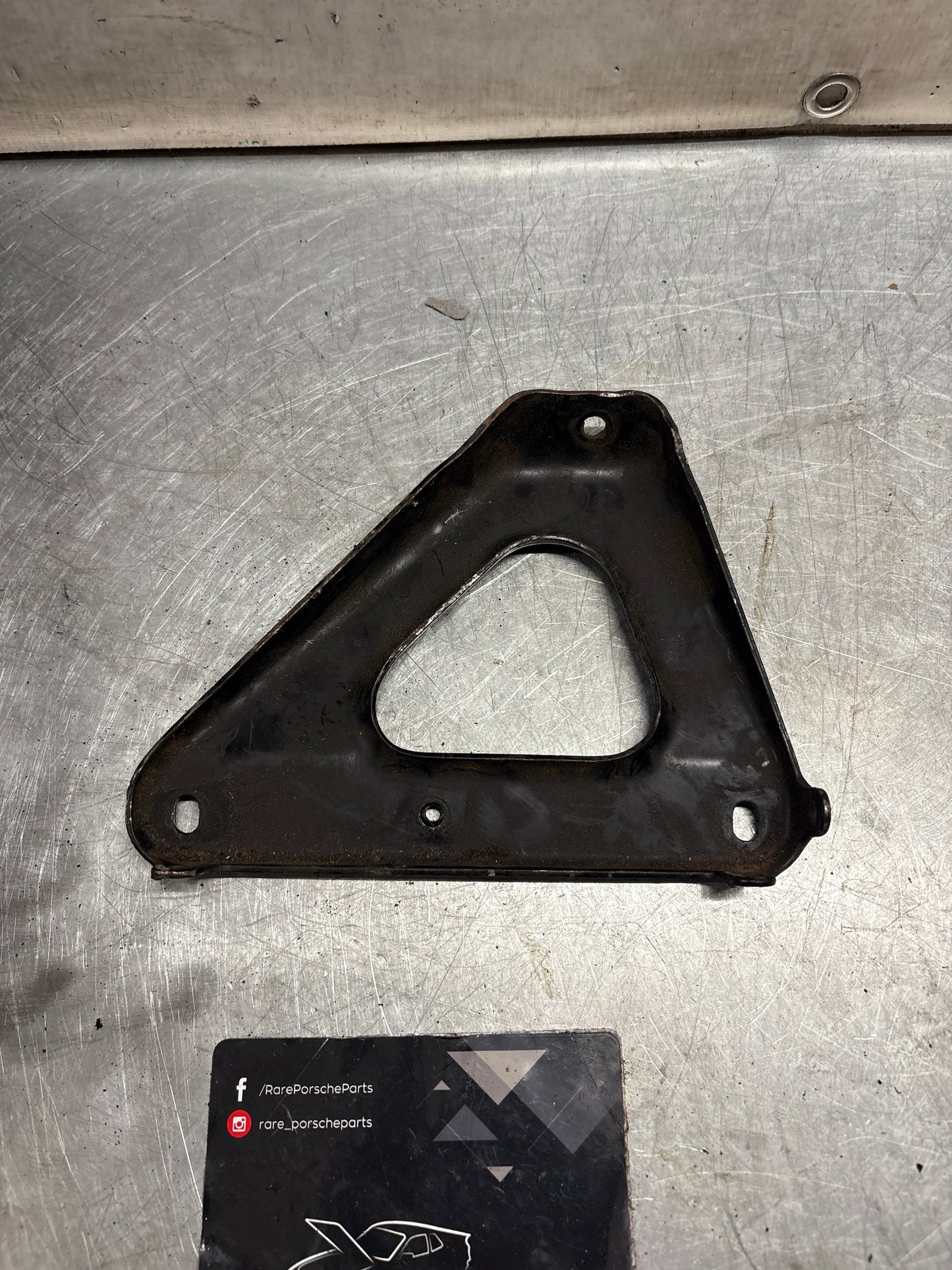 Porsche 924 exhaust manifold support bracket, used 93111014501