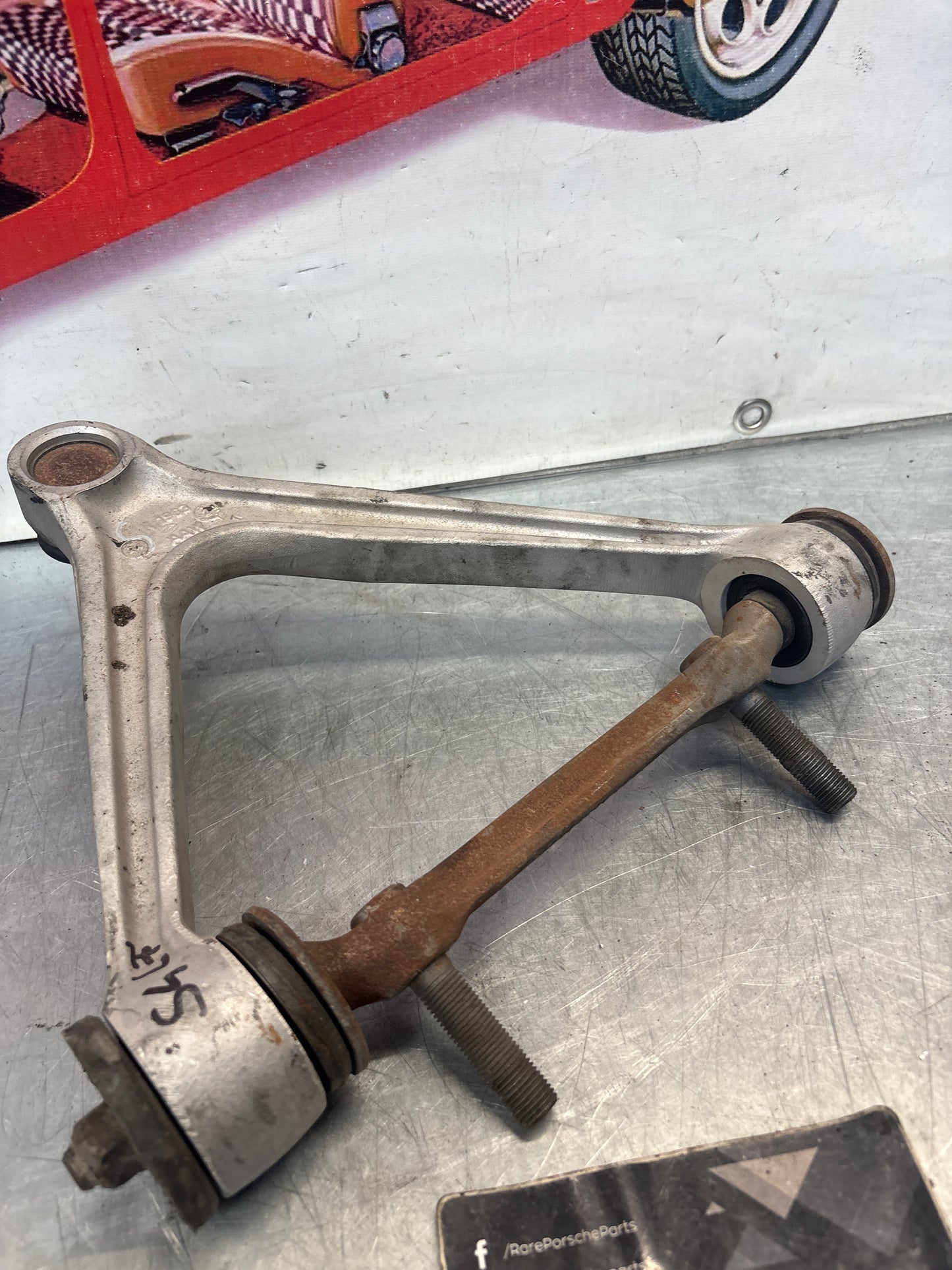 Porsche 928 front upper left control arm, used 92834145722