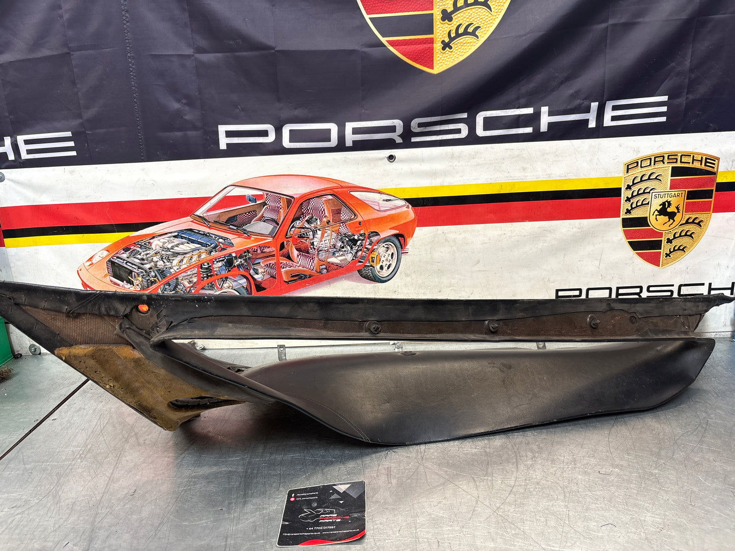 Porsche 928 early left side lower side trim panel, without loudspeaker, black used 92855502102