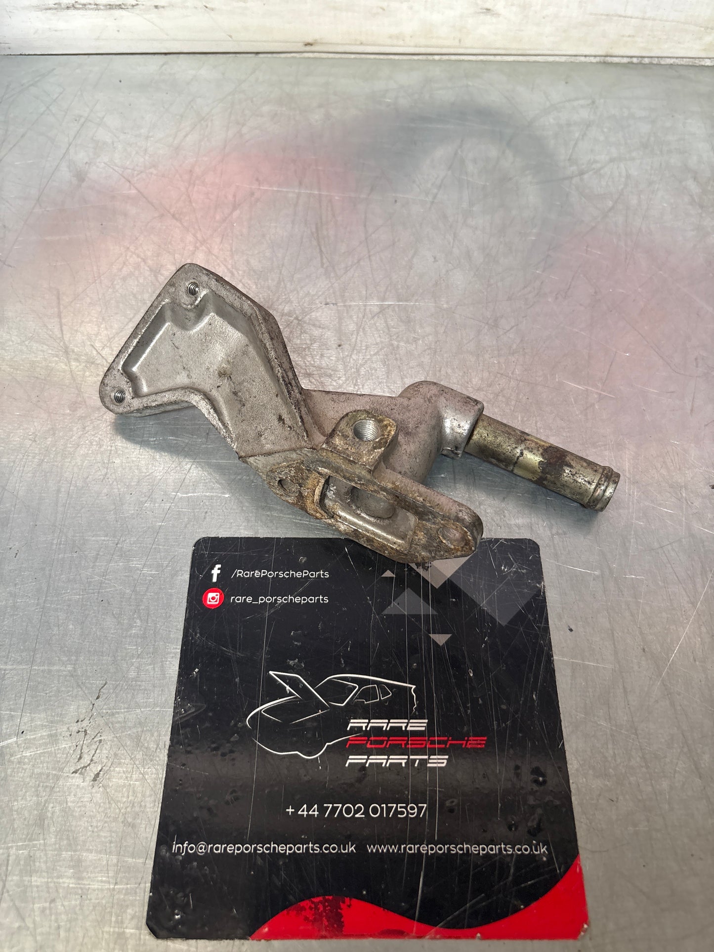 Porsche 928 water outlet housing, used 9281044310R