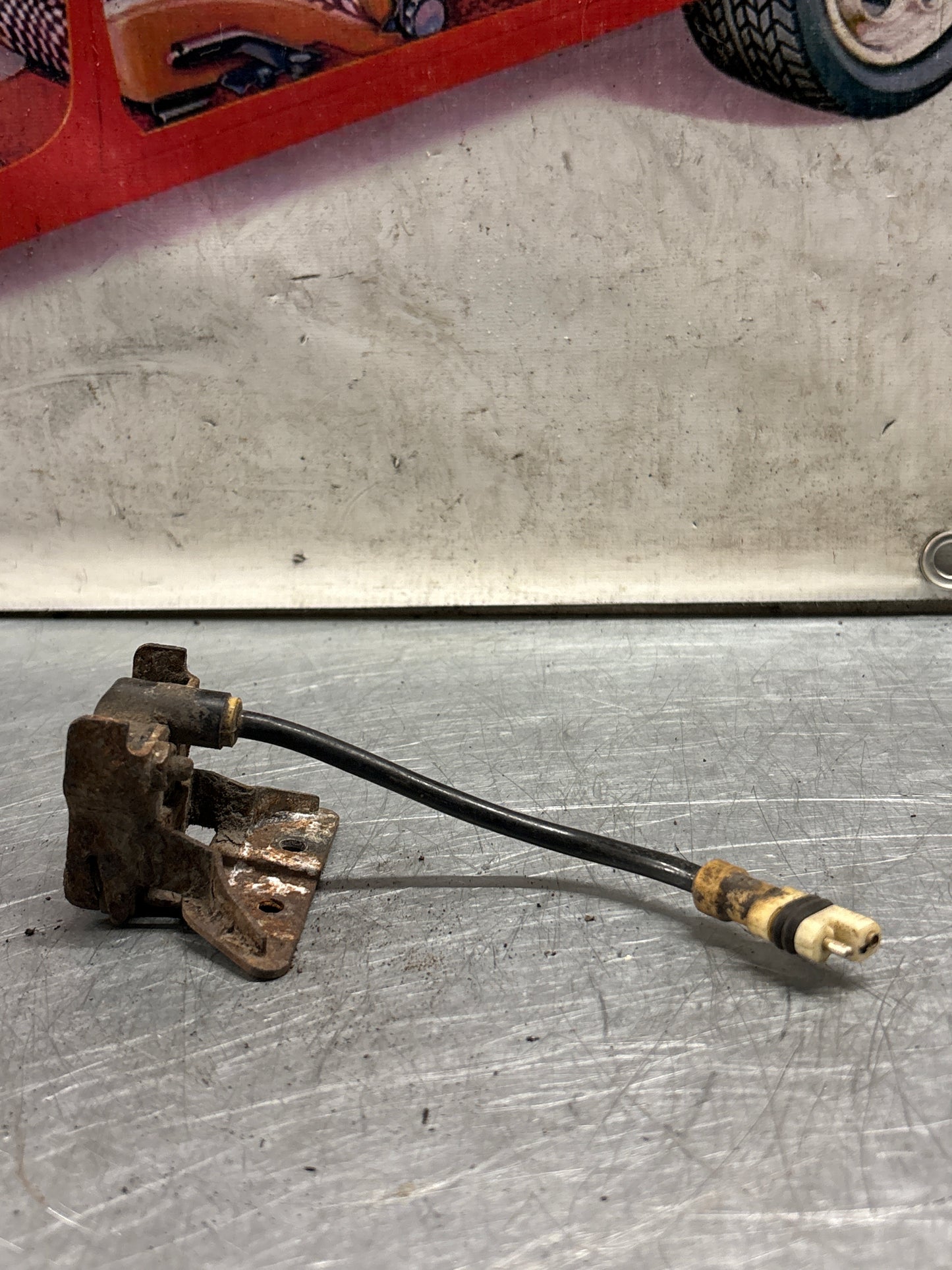 Porsche 928 S4 Tire pressure sensor with bracket, used 92860641400 / 0335569987 / 92833108101