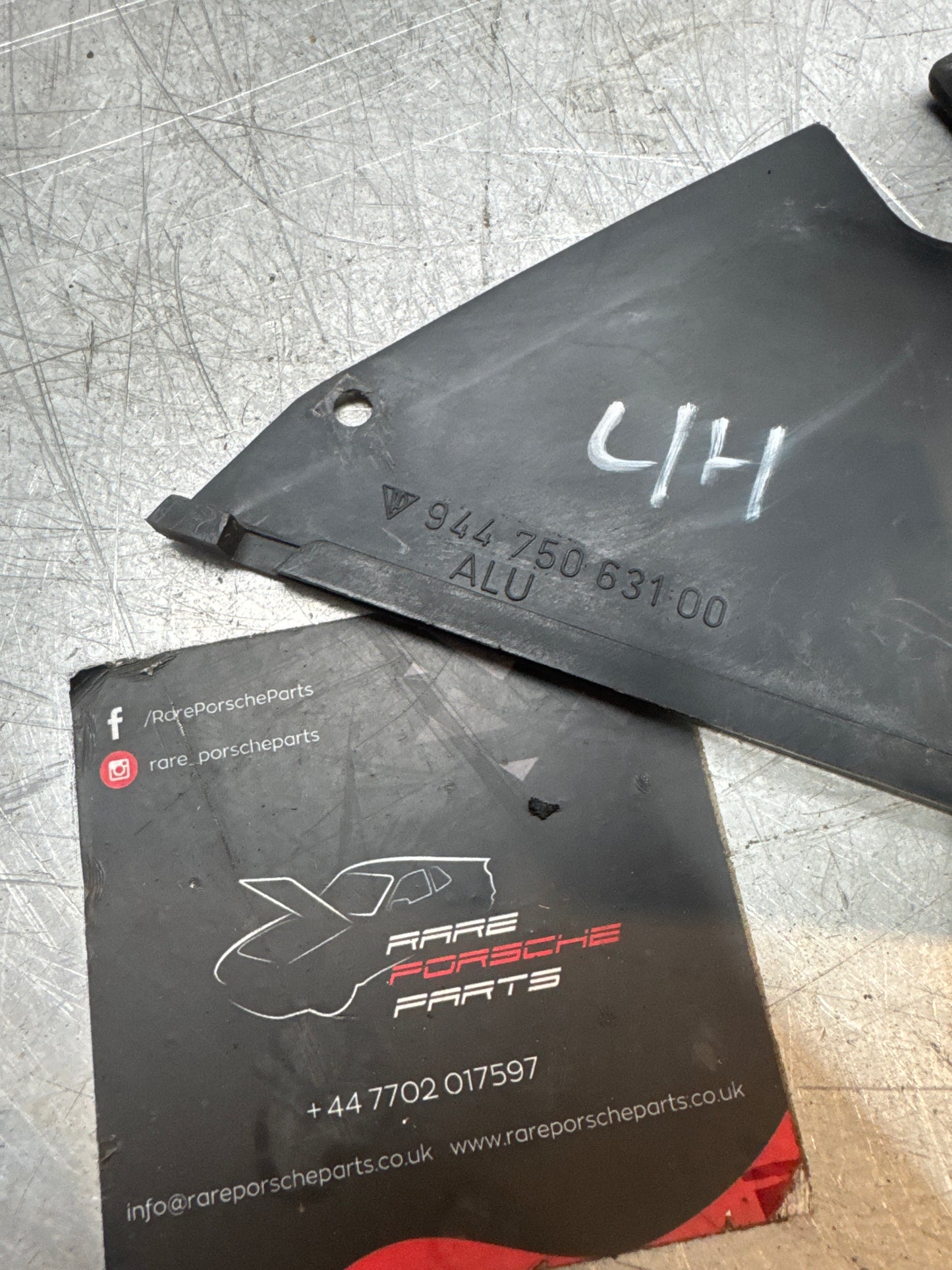 Porsche 944 924S left headlight lower surround shield 94475063100 used