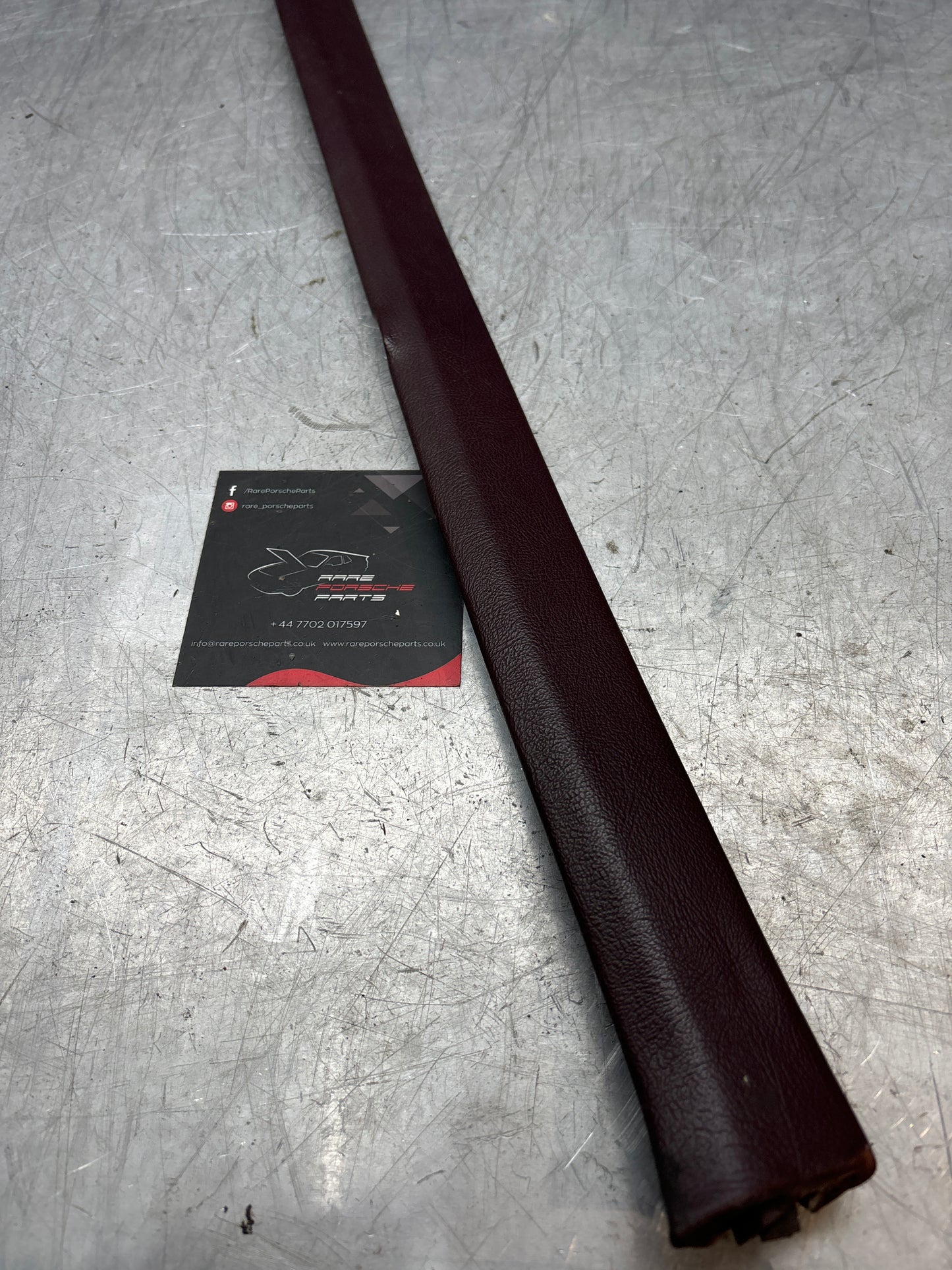 Porsche 928 Burgundy tailgate trim, left, used 92855503702
