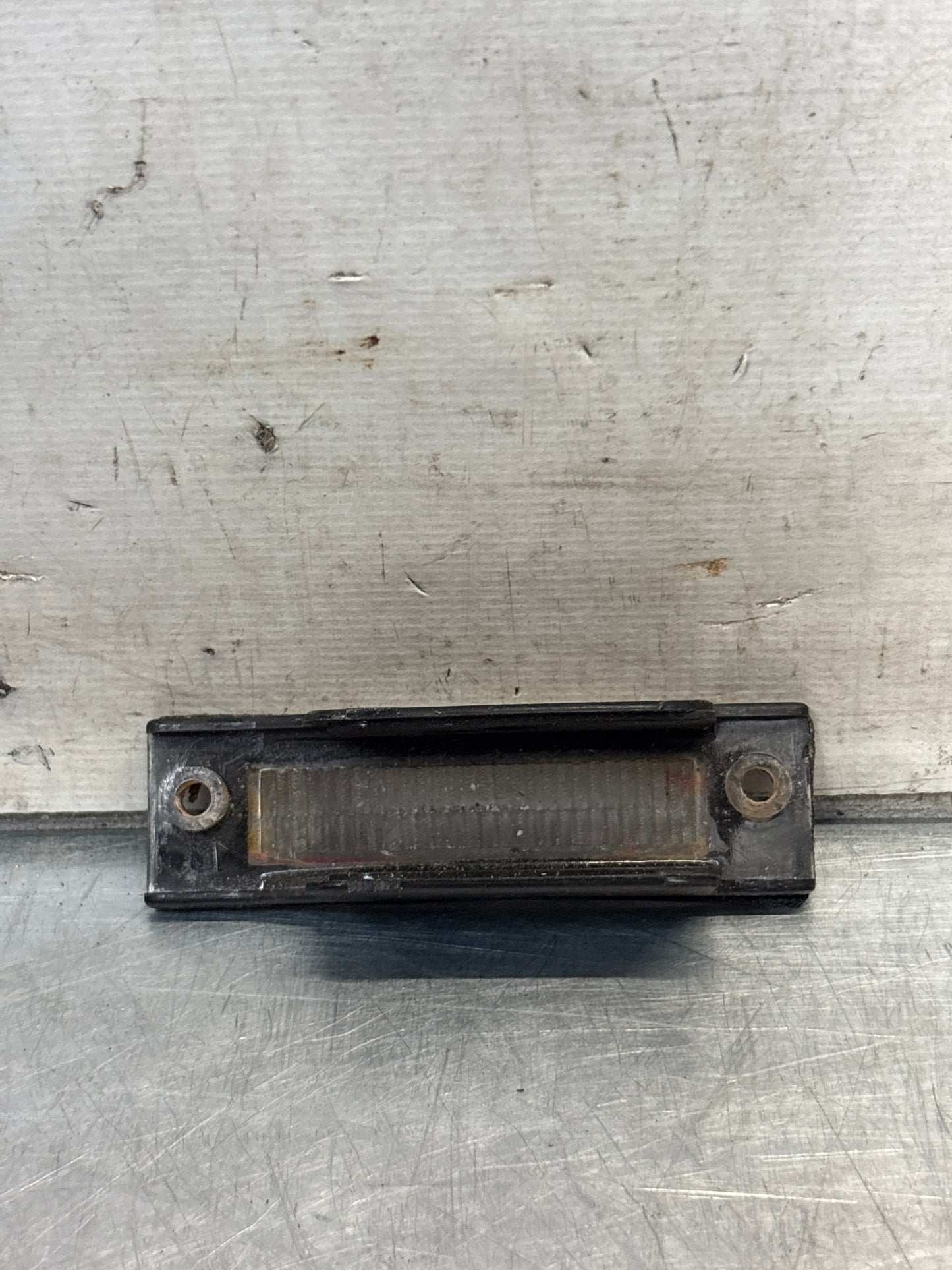 Porsche 924 / 944 rear number plate light cover assembly, used 477943021A