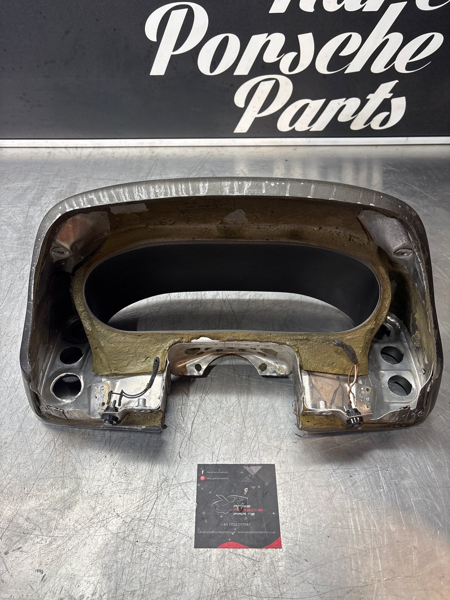 Porsche 928 speedometer cluster frame, 92855203102, black, used