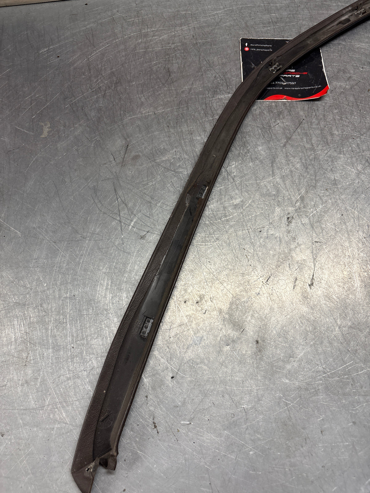 Porsche 928 left, off side door upper frame surround trim, brown 92855502502, used