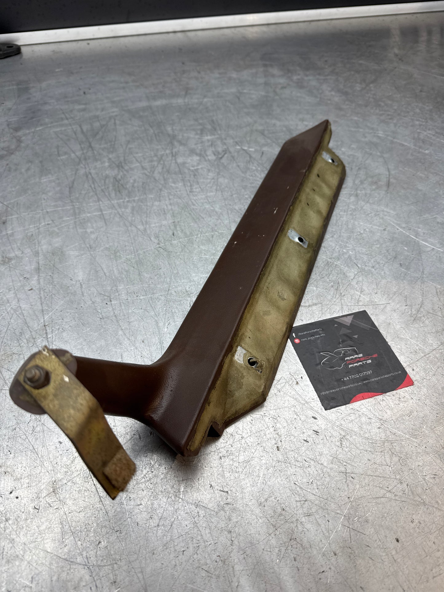 Porsche 944 left door pull handle armrest, brown 477867171 used