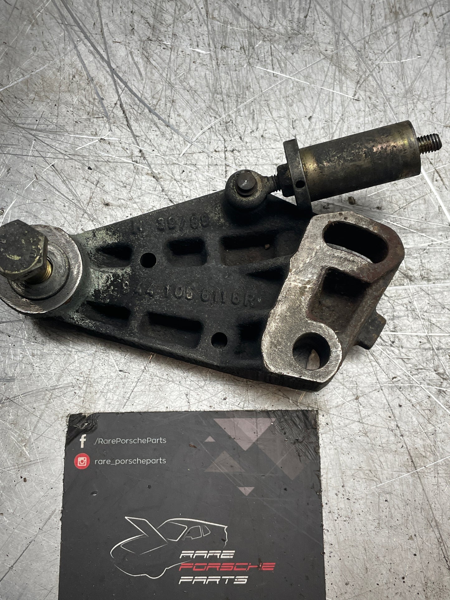 Porsche 944 timing belt tensioner bracket, used 9441056116R 94410561106