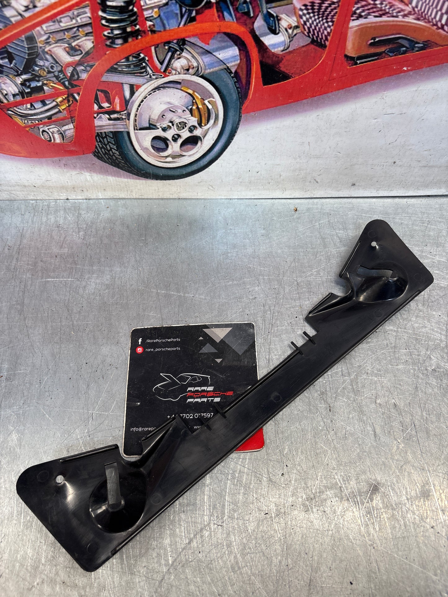 Porsche 928 instrument cluster lower trim, used 92855232102