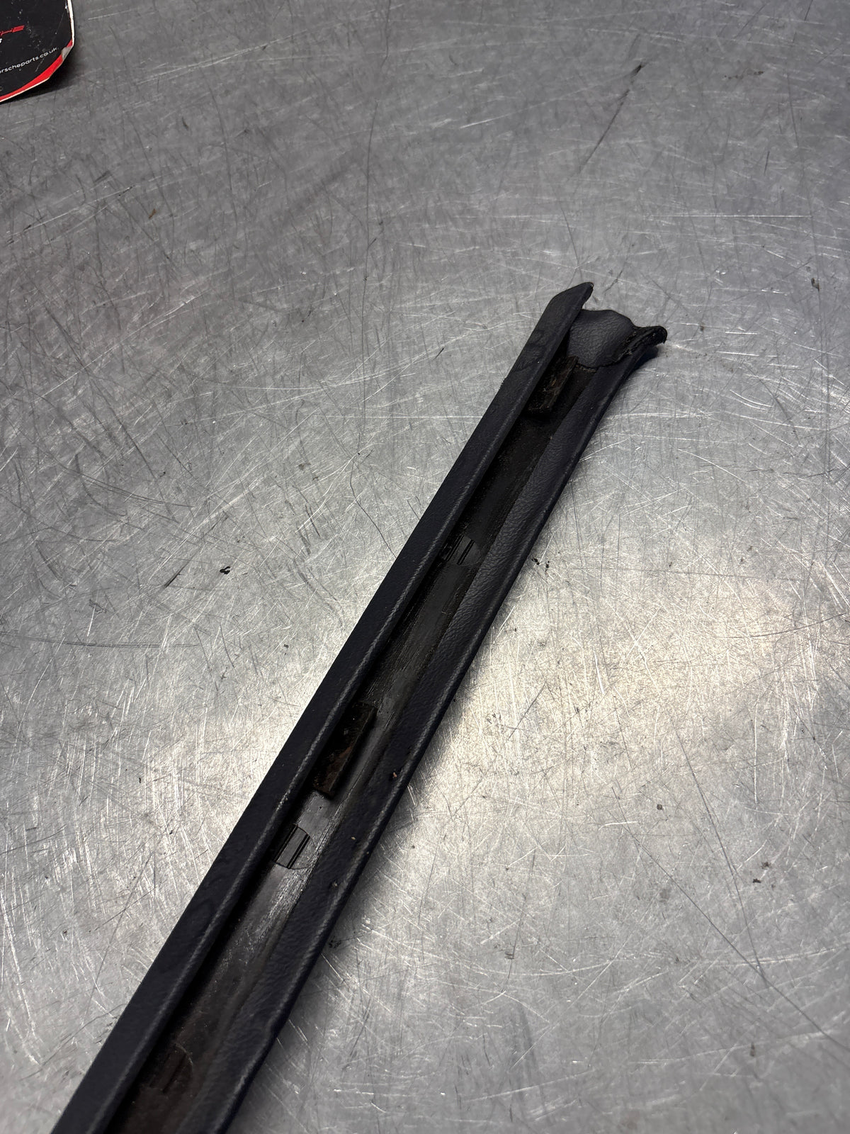 Porsche 928 tailgate trim, left, near side, marine blue, 92855503702, used