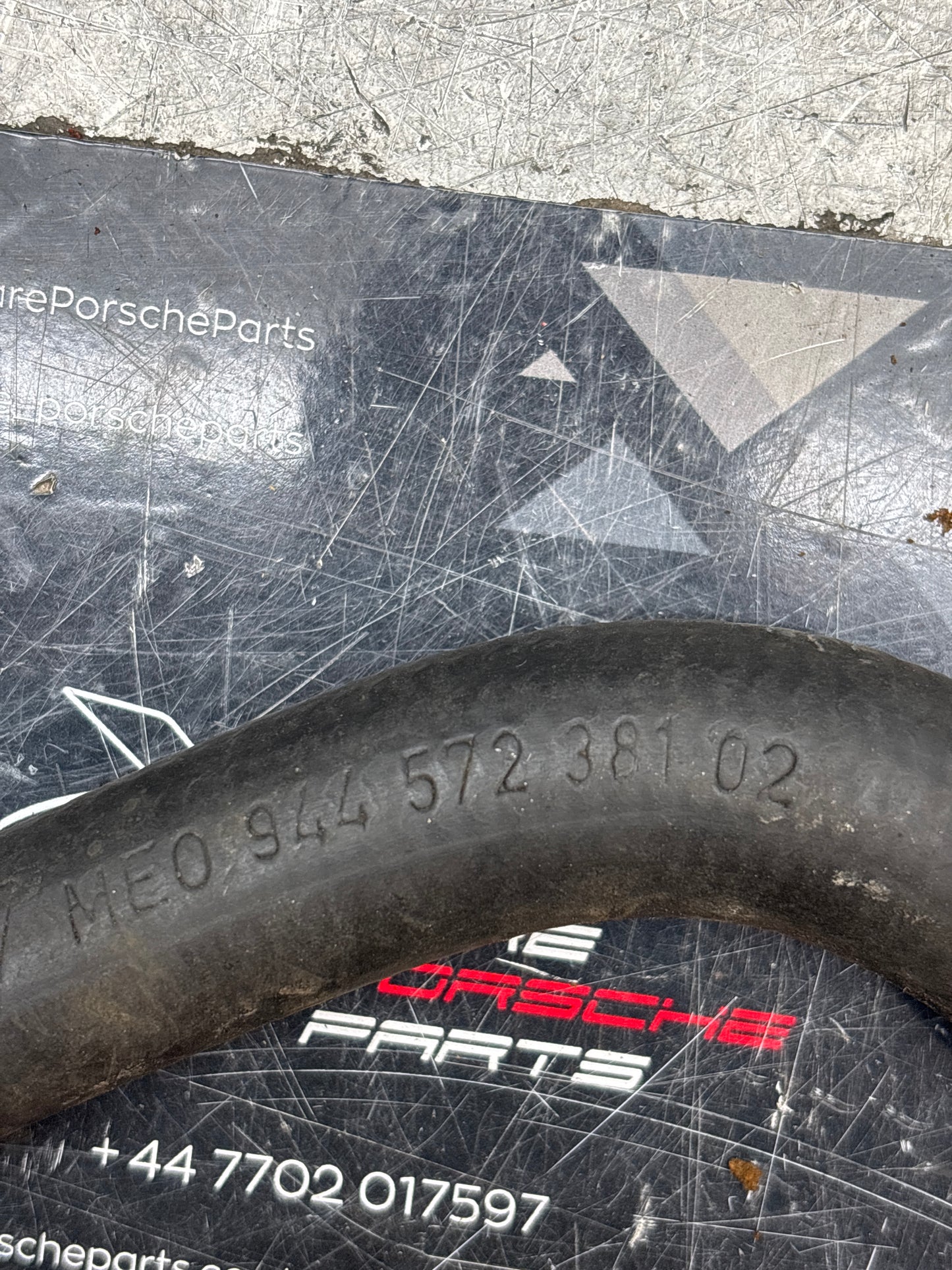 Porsche 924S / 944 82-85.5 Hose on heat exchanger, 94457238102 used