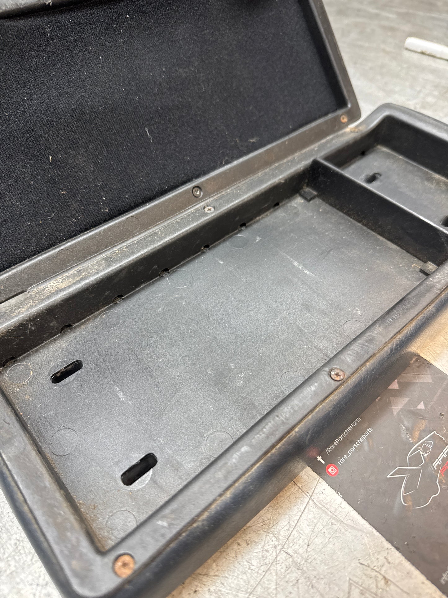 Porsche 928 92755572903 Central armrest cassette compartment black, used RHD
