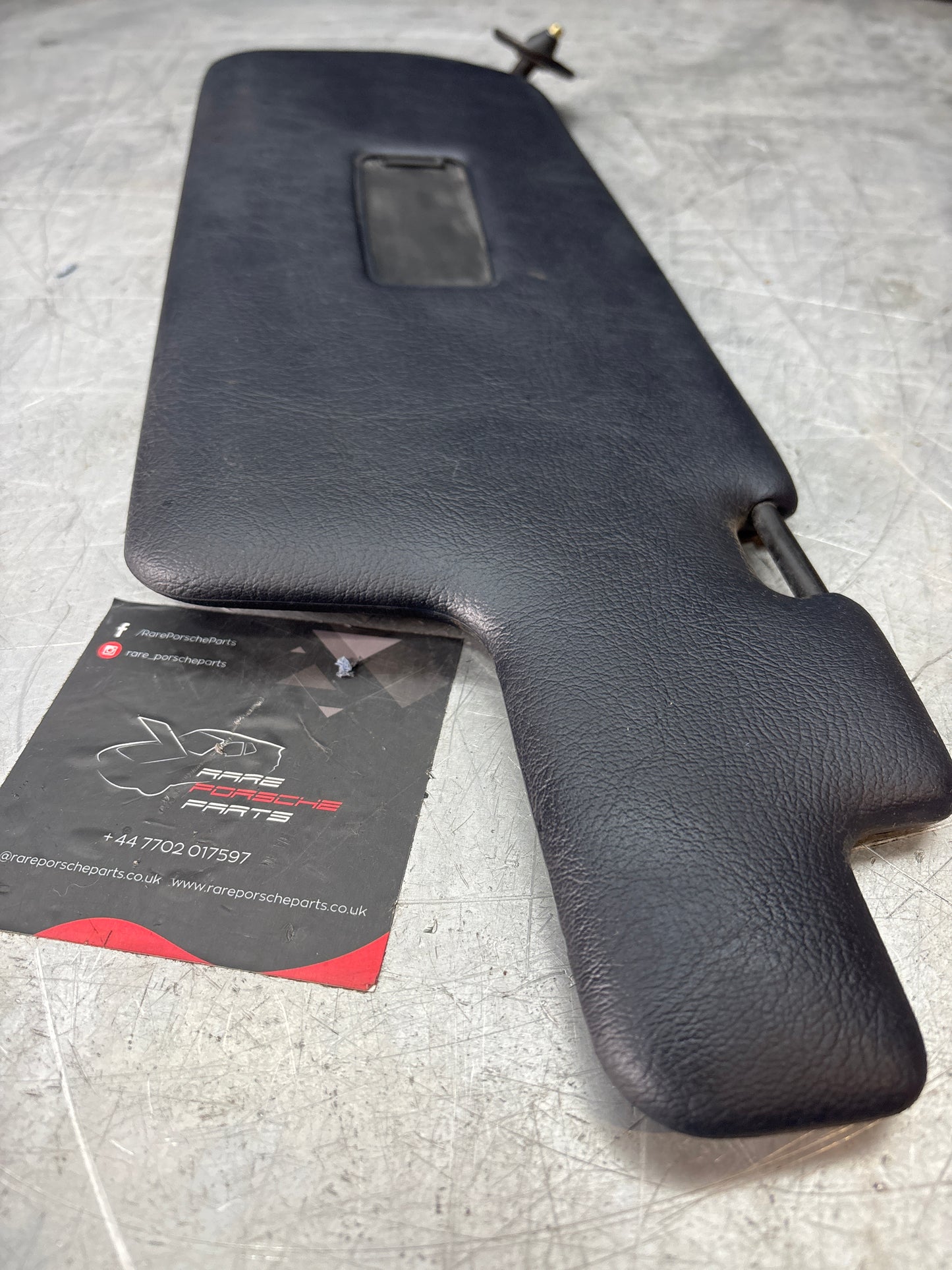 Porsche 944 left N/S sun visor in cobalt blue, used for late cars 94473103101