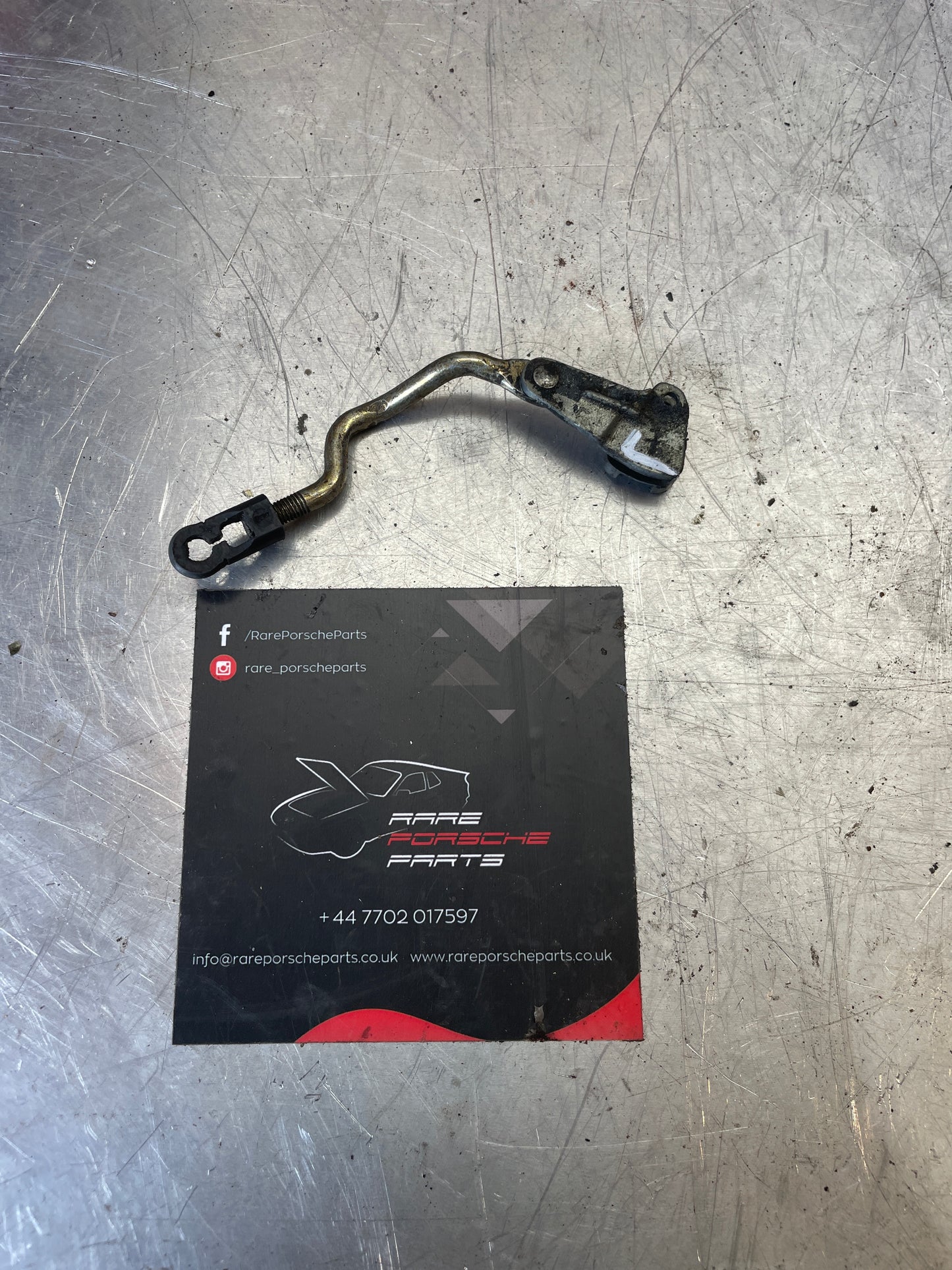 Porsche 924 944 external door handle linkage, left, reverse lever 94453726101, used