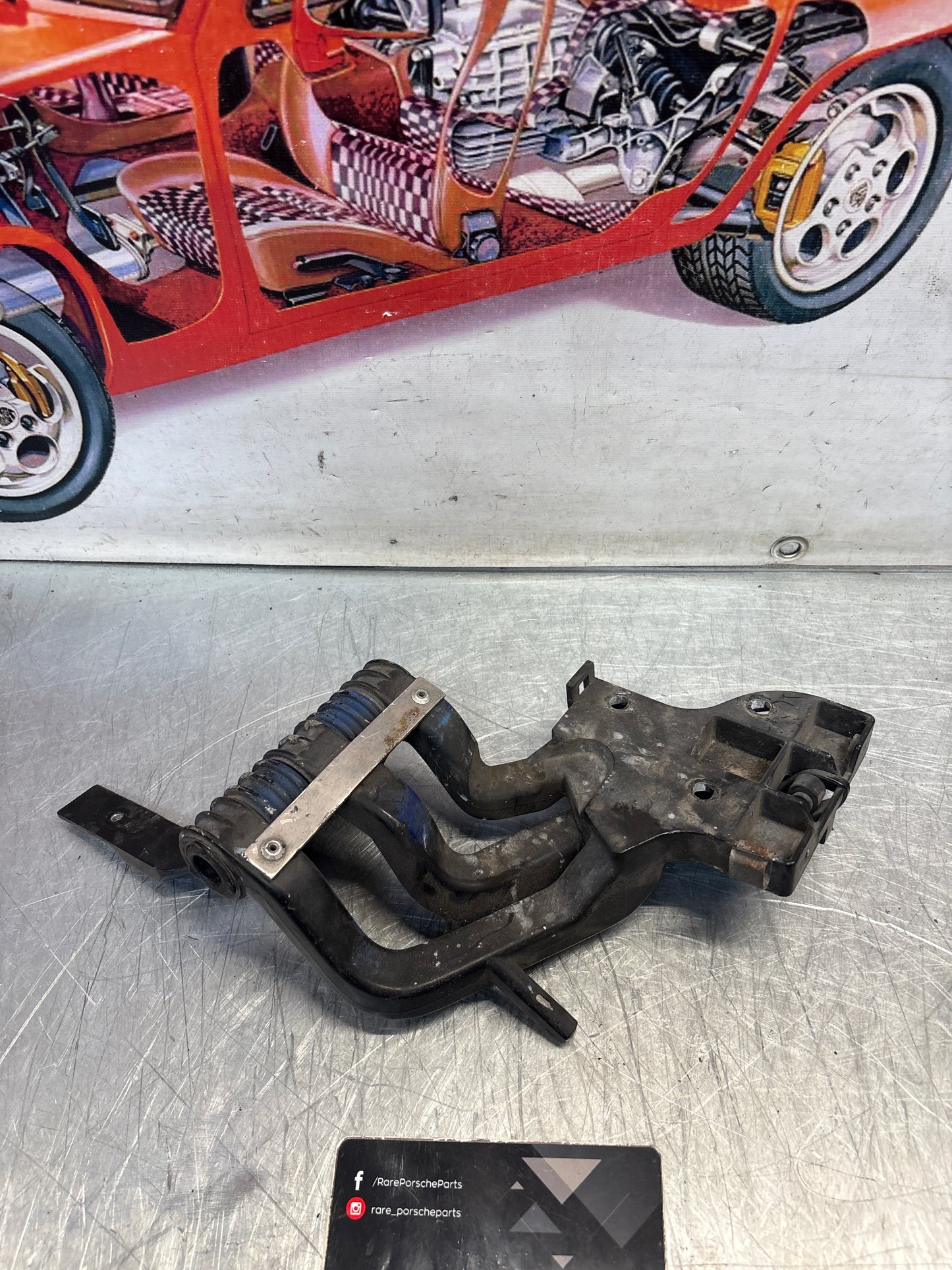 Porsche 968 right headlight swivel frame, used 94475057200 / 94475057400 / 94475037800