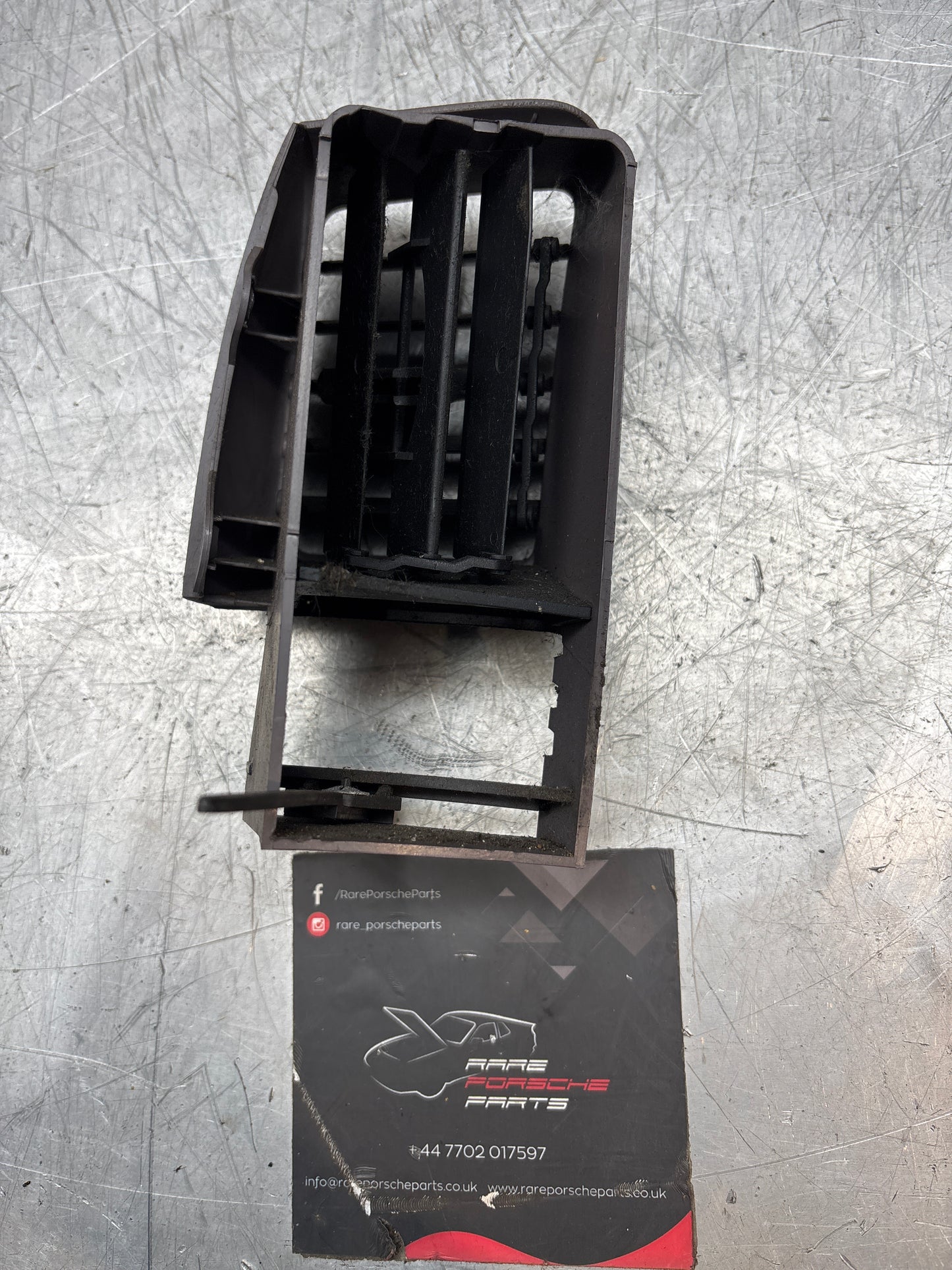 Porsche 944 grey right Interior dash air vent, black vents. 94457225200 used