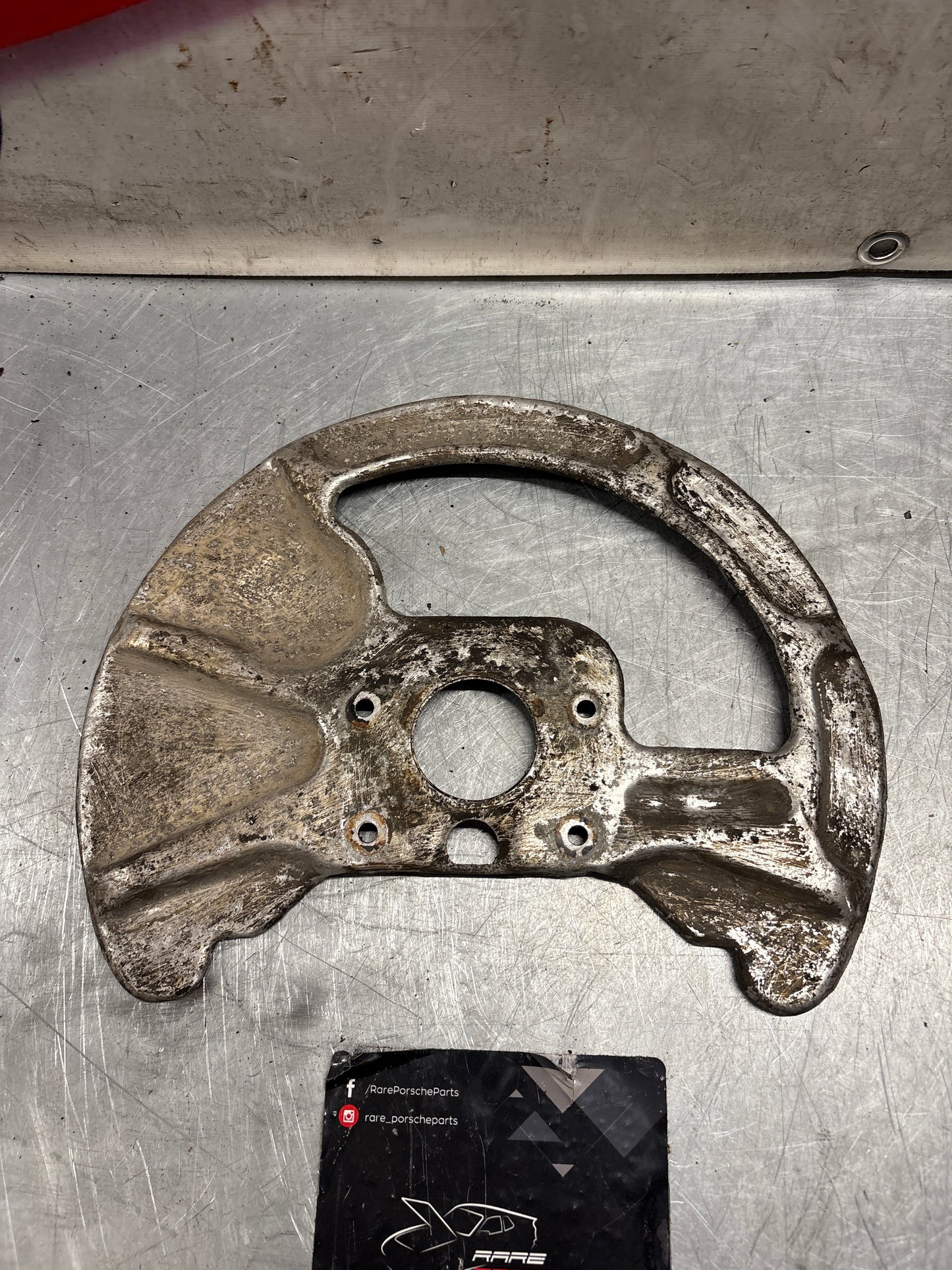 Porsche 928 front right brake disc cover,used 92835108400