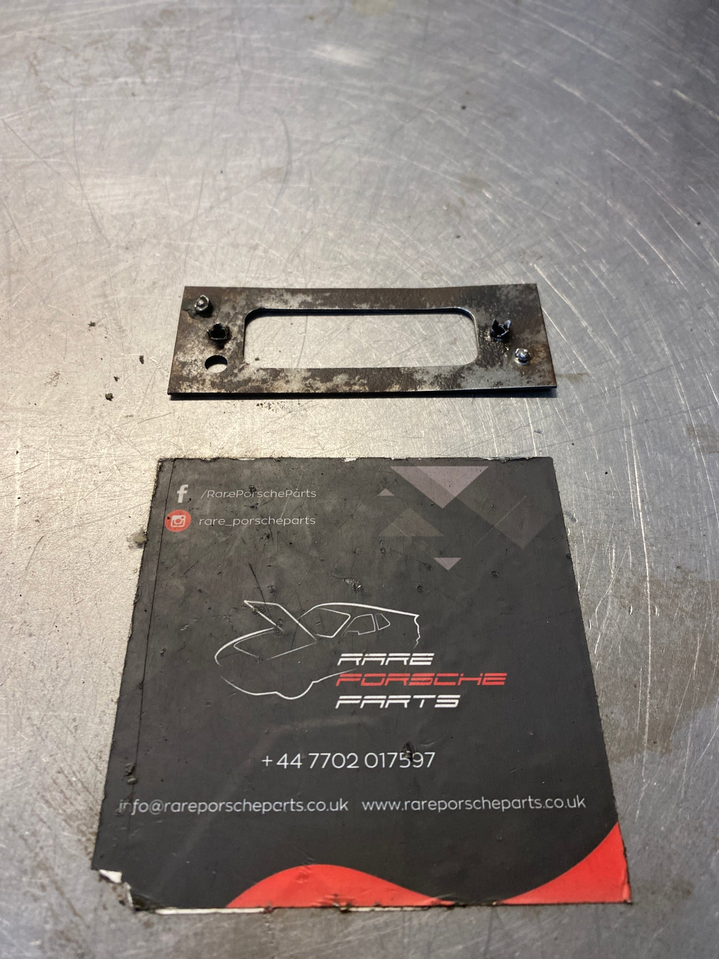 Porsche 928 rear license securing plate, used 92850511202