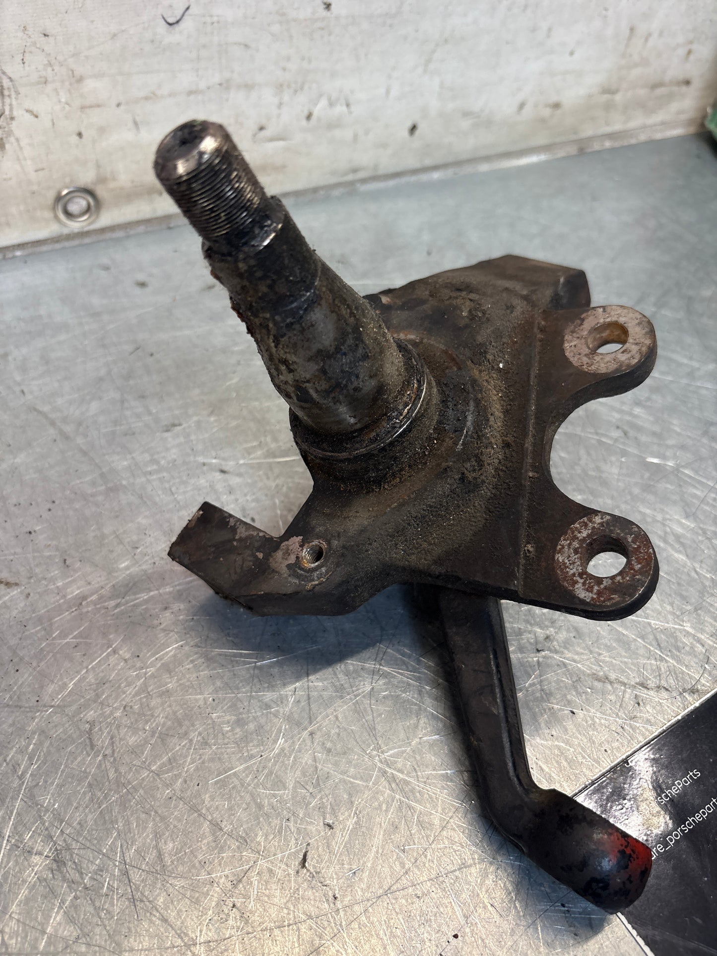 Porsche 928 left steering spindle knuckle, used 92834105703