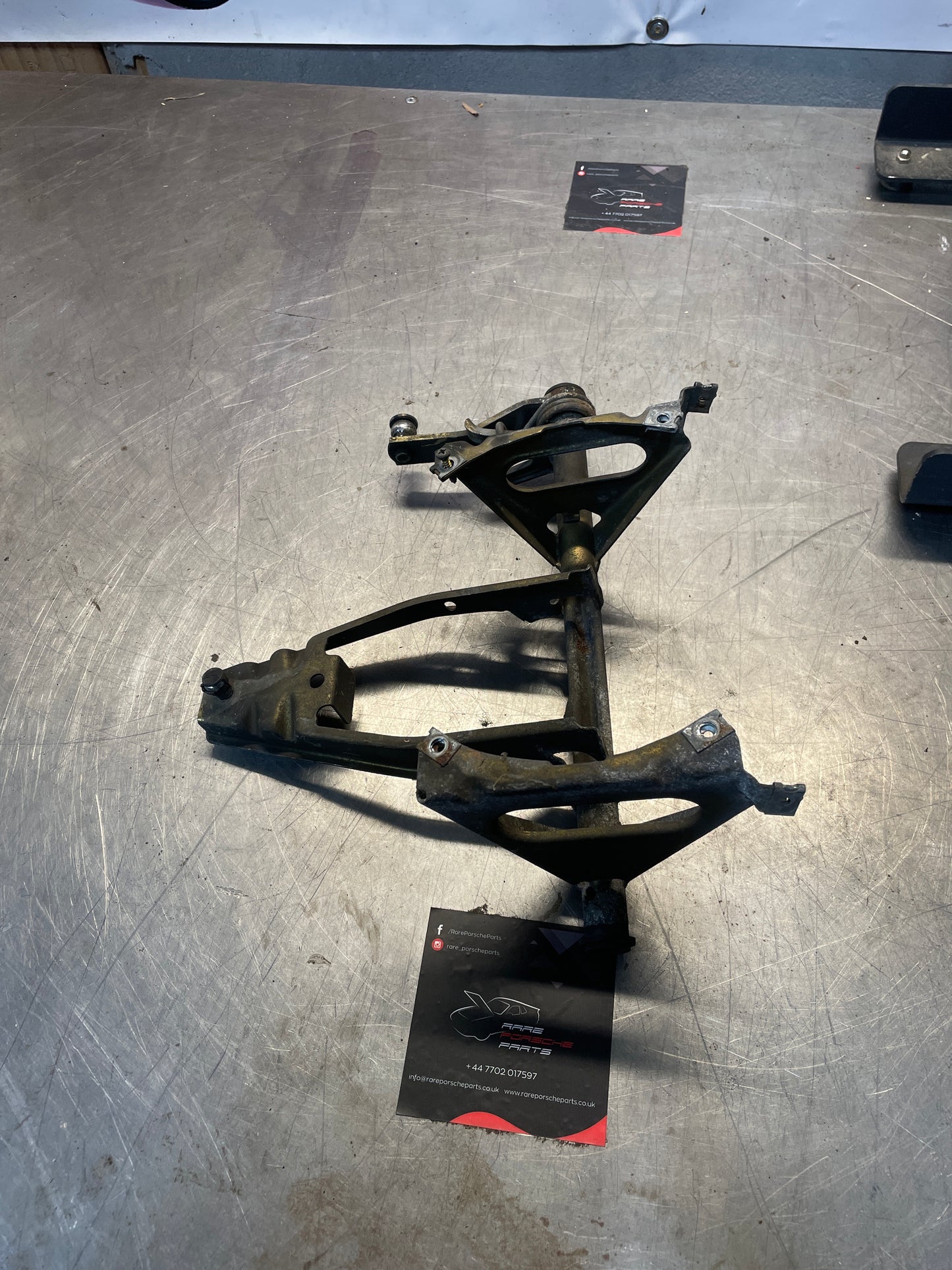 Porsche 924 944 right, near side headlight swivel frame, bracket 94475060600, used