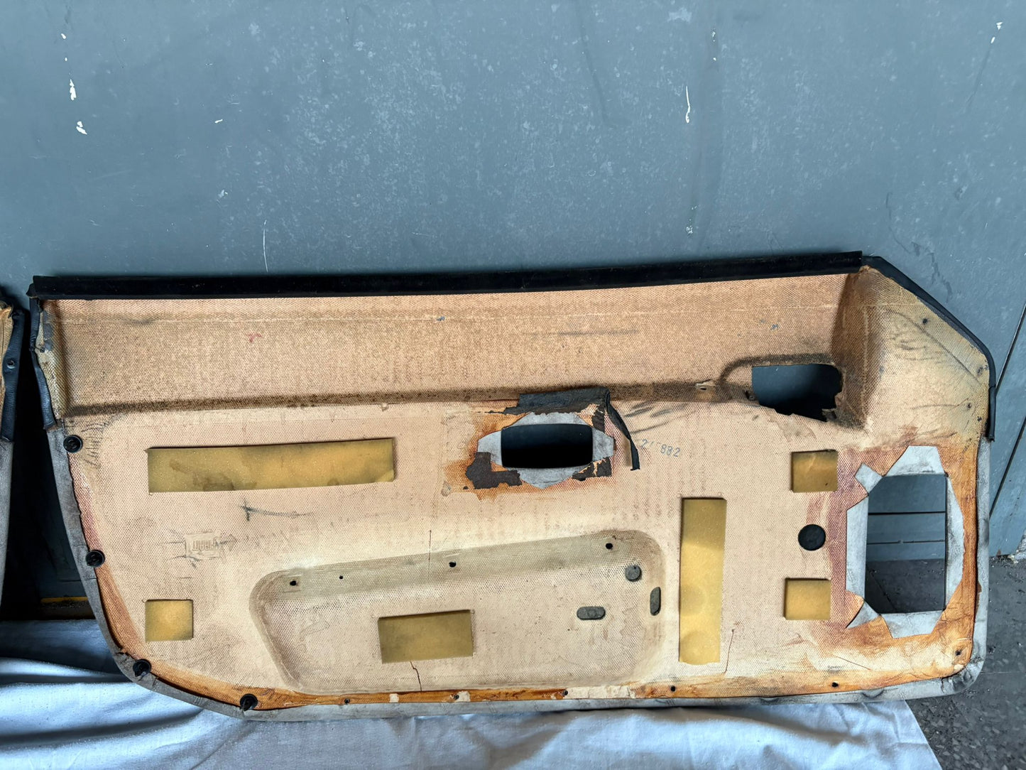 Pair Of Porsche 944 black/cream Porsche scripted fabric door cards 94455501701 / 94455501801 used, very nice condition.