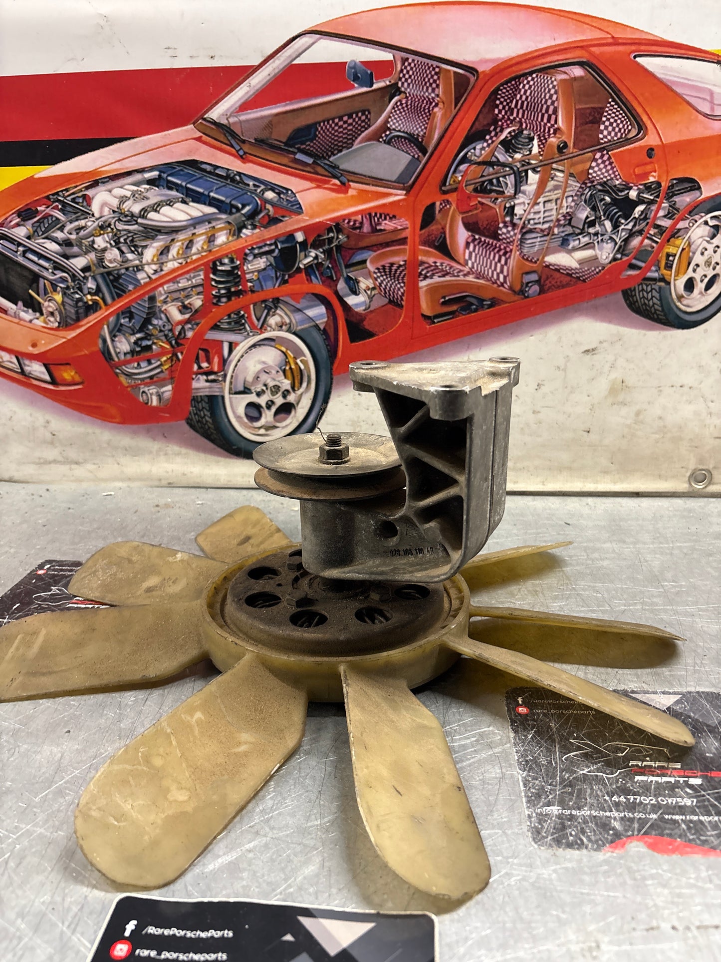 Porsche 928 late engine cooling fan clutch with bracket, used 92810611205 / 92810613701 / 9281061104R