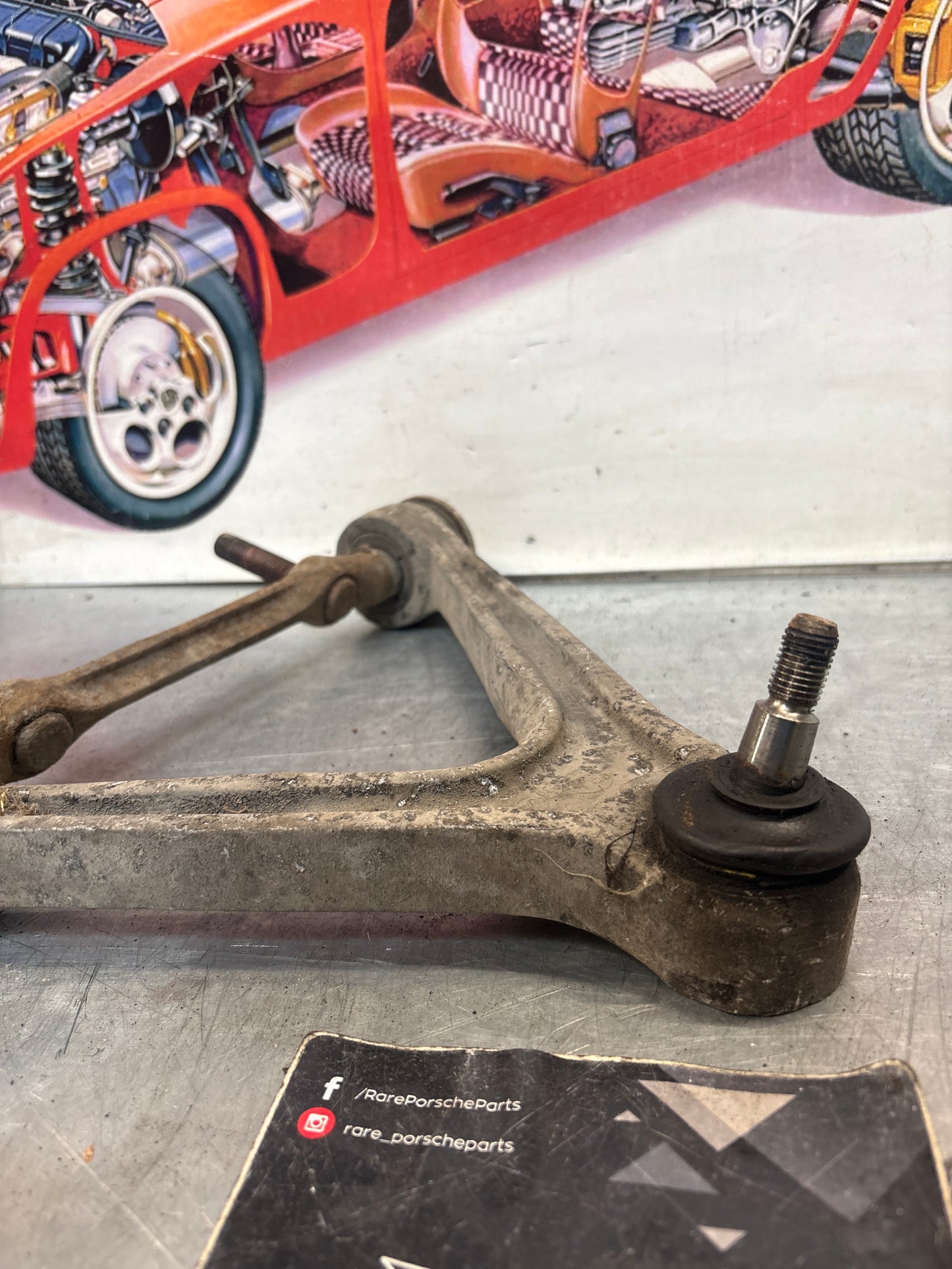 Porsche 928 front upper left control arm, used 92834145722