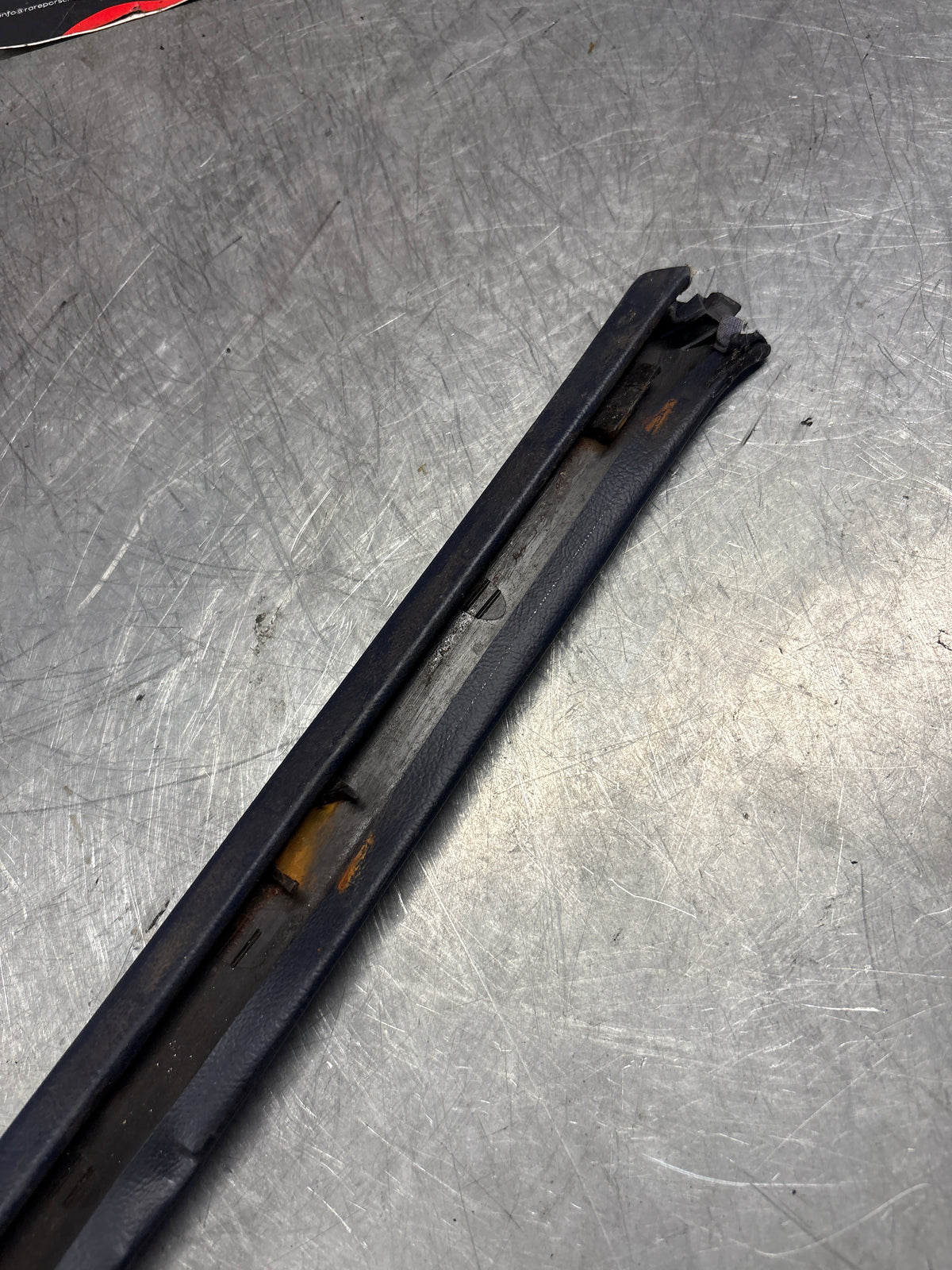 Porsche 928 tailgate trim, left, near side, marine blue, 92855503702, used