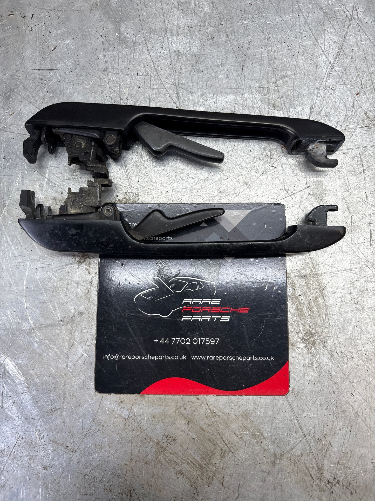 Porsche pair of 944 scripted door handle, used 94453706100 / 94453706200