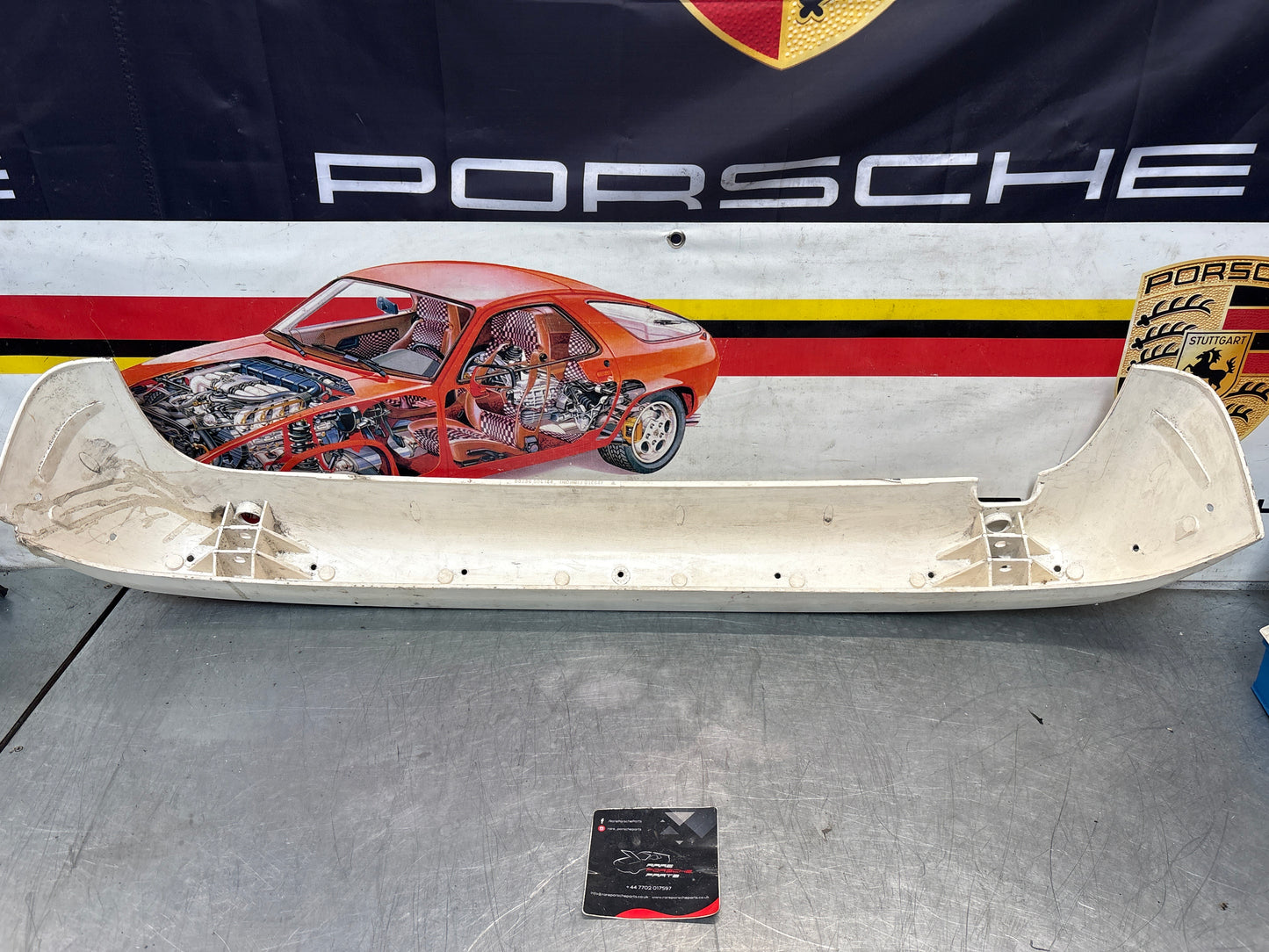 Porsche 944 rear bumper, NOS damaged 93150538700