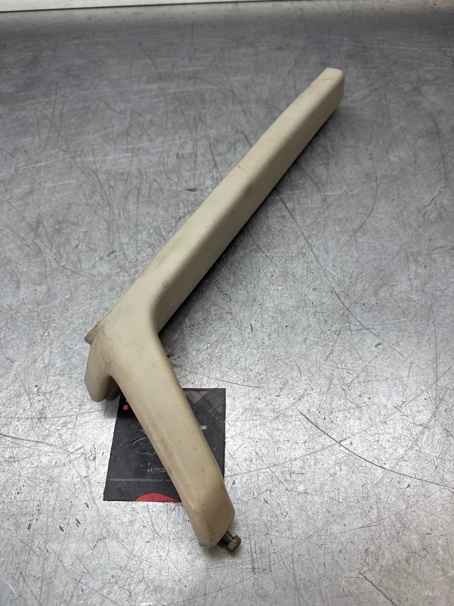 Porsche 944 left door pull handle armrest, white 477867171 used