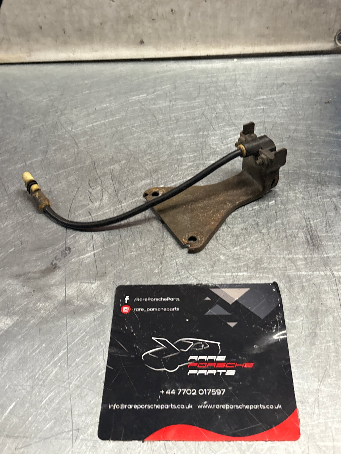 Porsche 928 tire pressure gauge with support bracket, used 92834108501