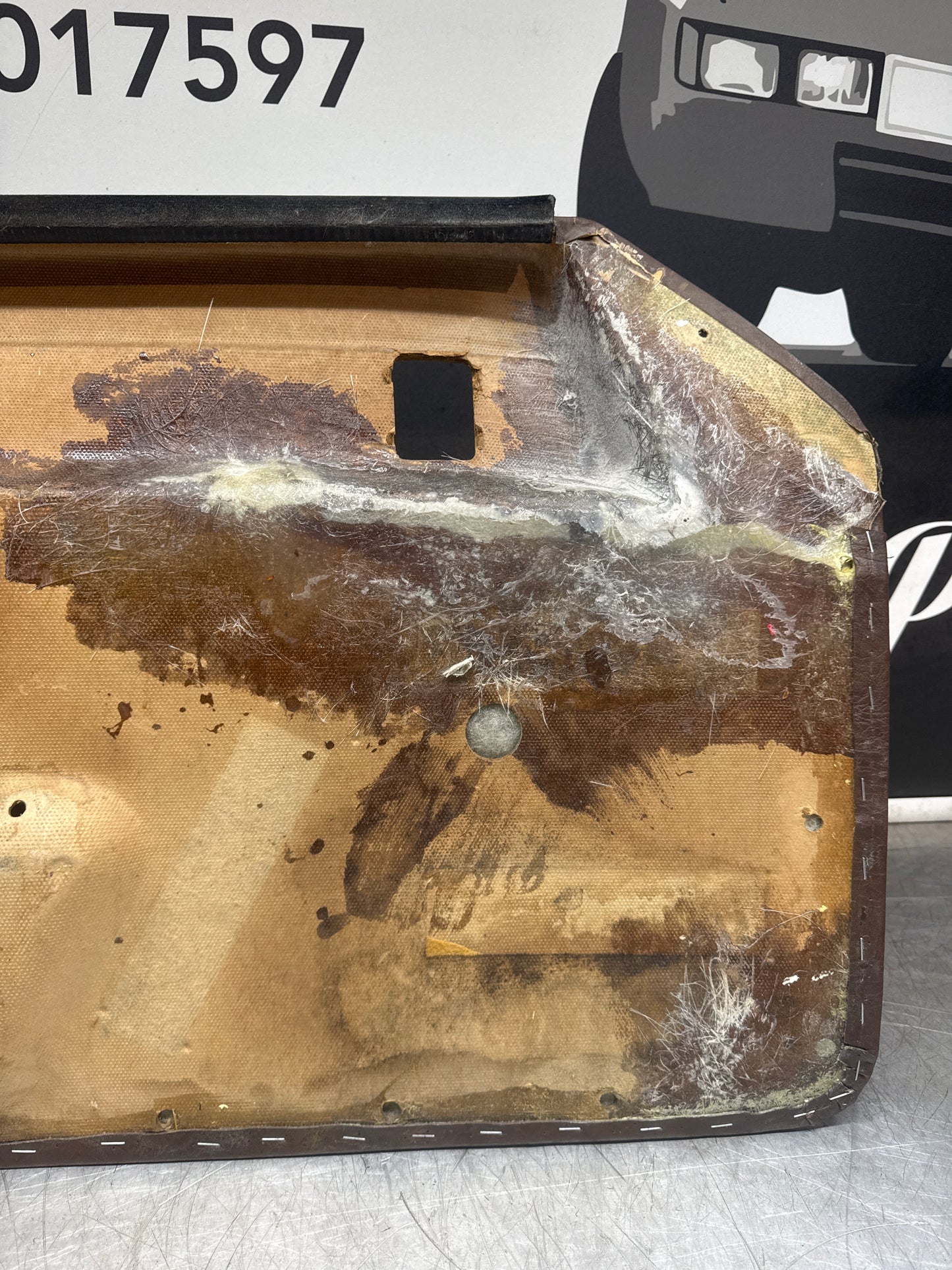 Porsche 924 / Early 944 Brown Script Door card. Left Hand Drive. Used. 478867011. Fibreglass repaired.