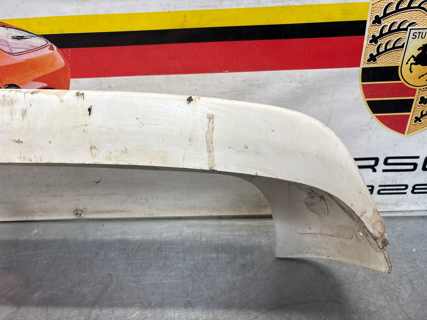 Porsche 944 rear bumper, NOS damaged 93150538700
