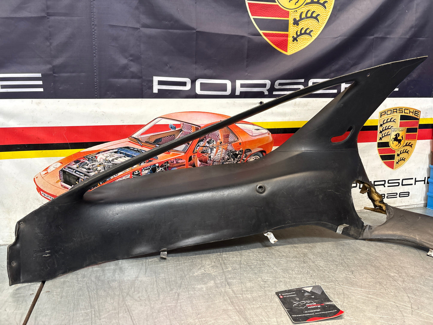 Porsche 928 early left side lower side trim panel, without loudspeaker, black used 92855502102