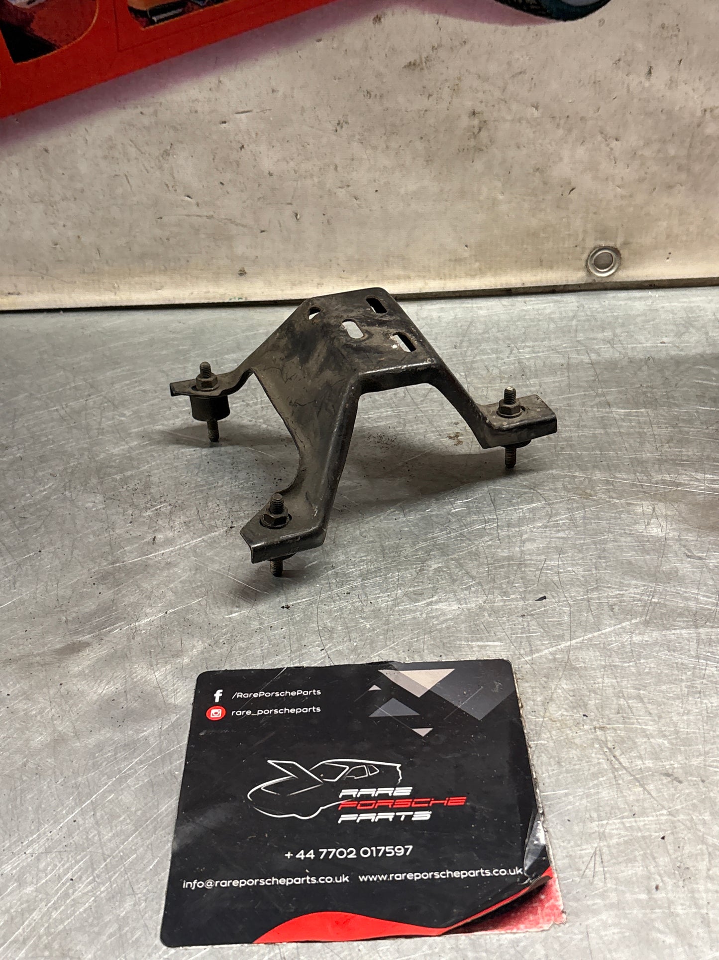 Porsche 924 Turbo air filter housing support bracket 477805513, used