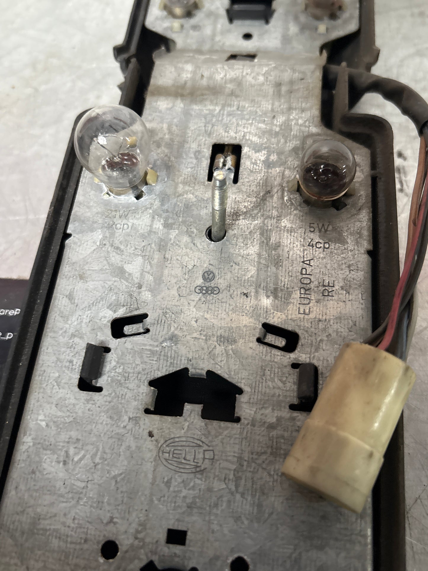 Porsche 944 rear left Tail light lamp bulb holder and cover, used 477945113