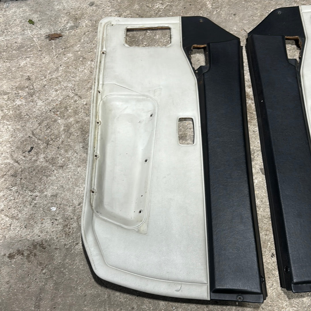 Porsche 944 pair of late door cards, cream/black, used