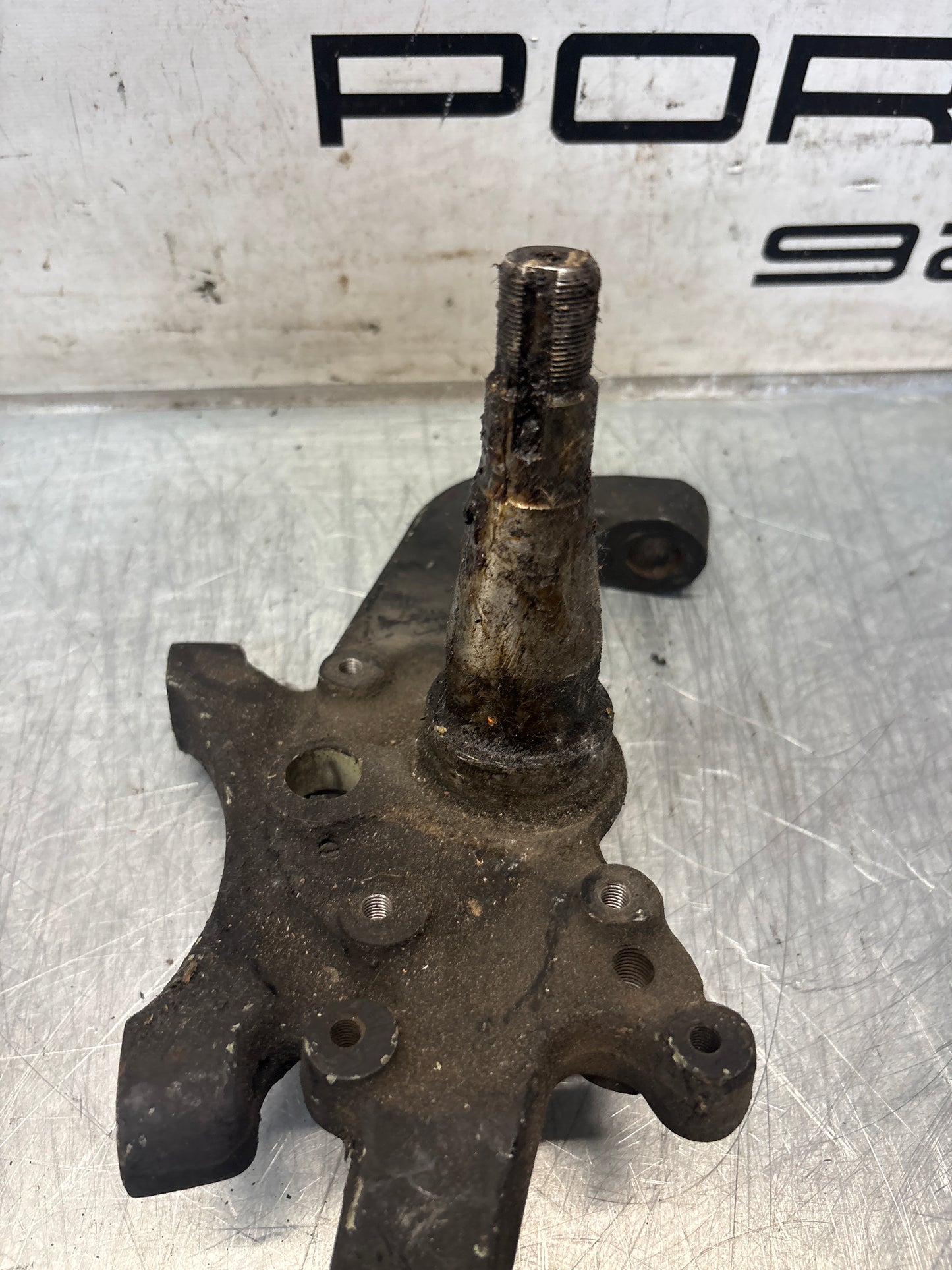 Porsche 928 left steering spindle knuckle, used 92834105717 / 92834105723