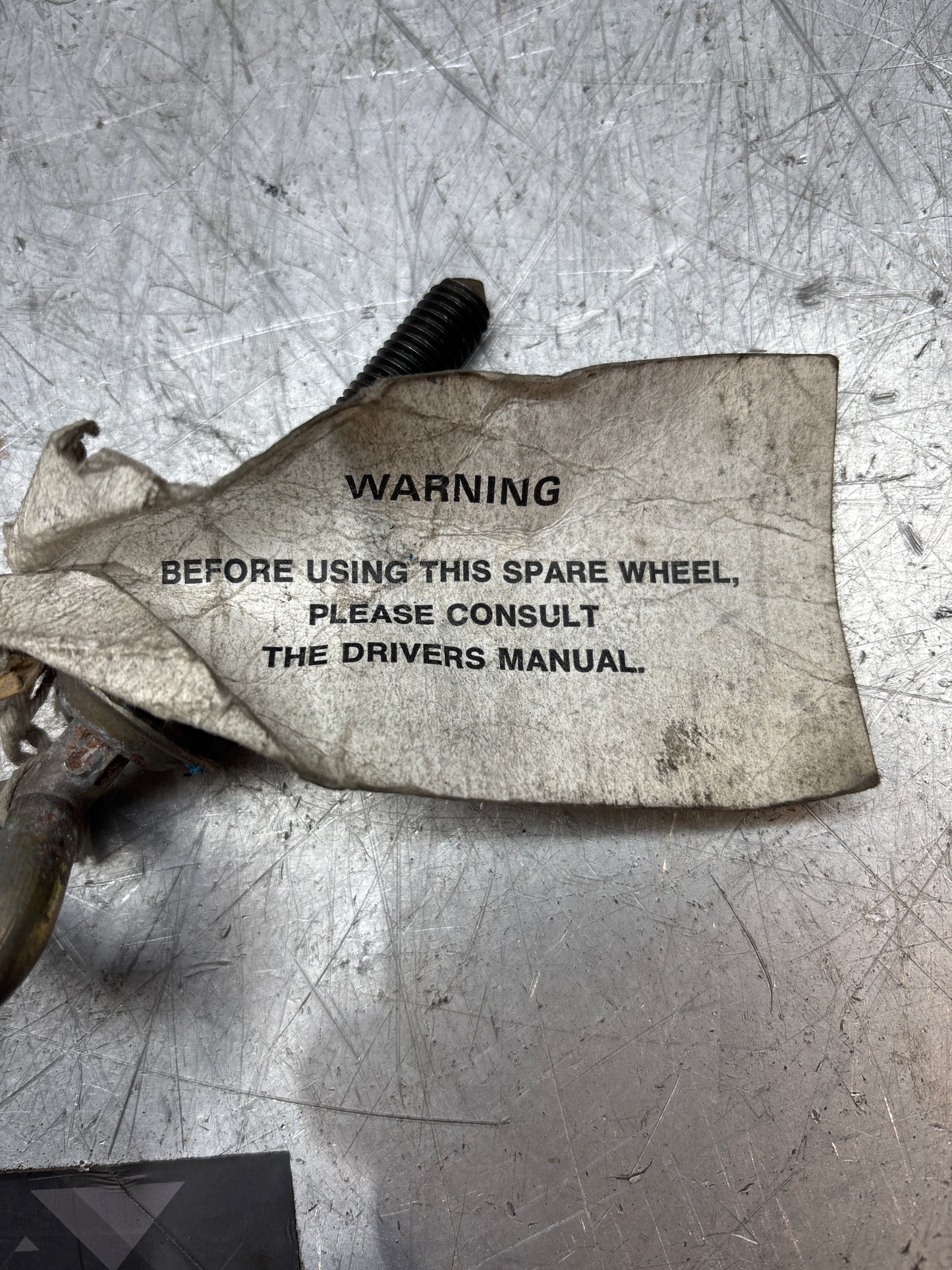 Porsche 924/944 spare wheel retaining plate & long bolt, with genuine label on it