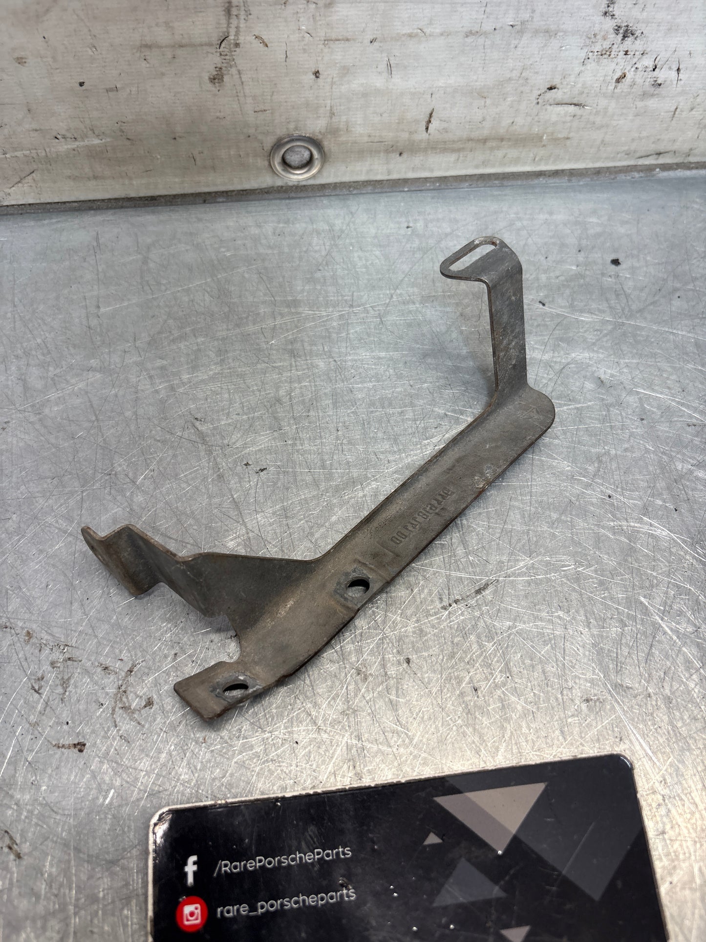Porsche 944 steering coloumn bracket, left, used 94461814100