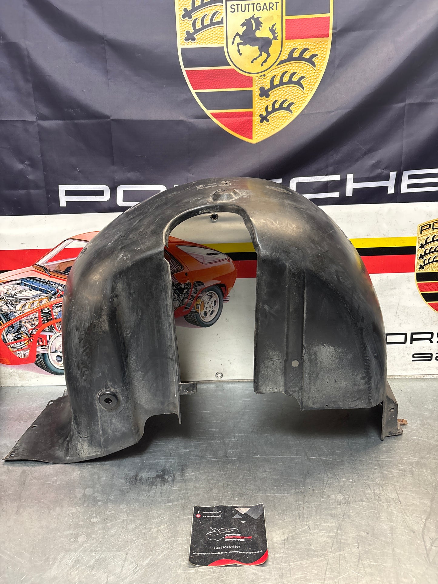 Porsche 944 from 85.5 wheel arch liner  Left, 94450438101 Used