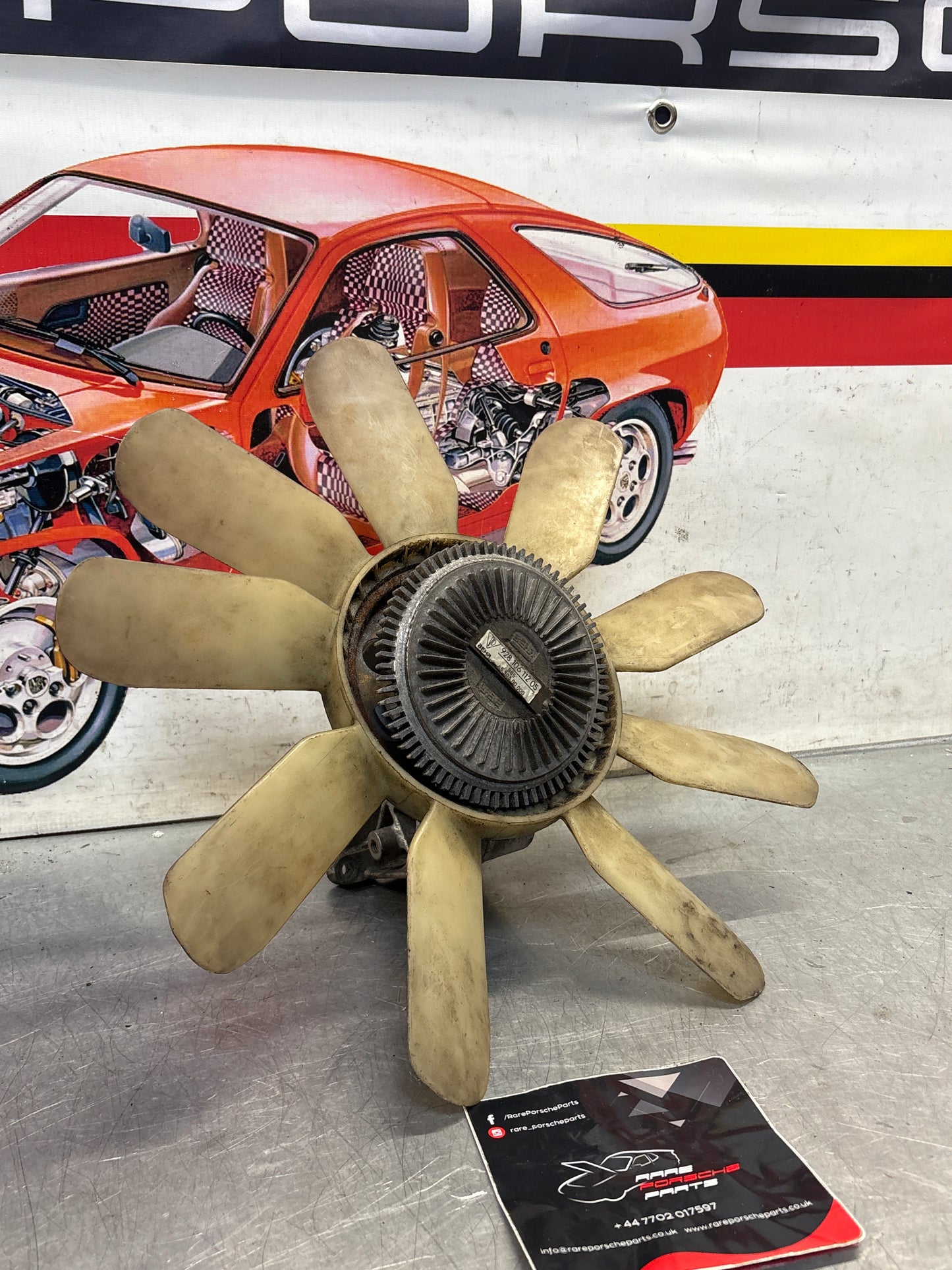 Porsche 928 late engine cooling fan clutch with bracket, used 92810611205 / 92810613701 / 9281061104R