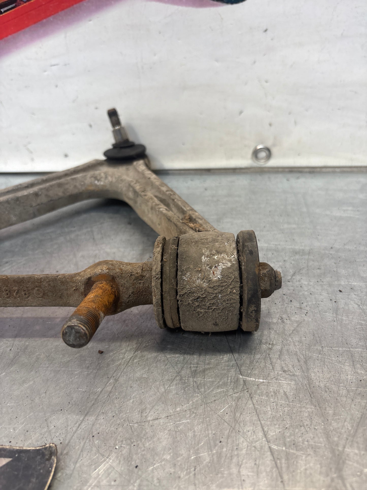 Porsche 928 front upper left control arm, used 92834145722